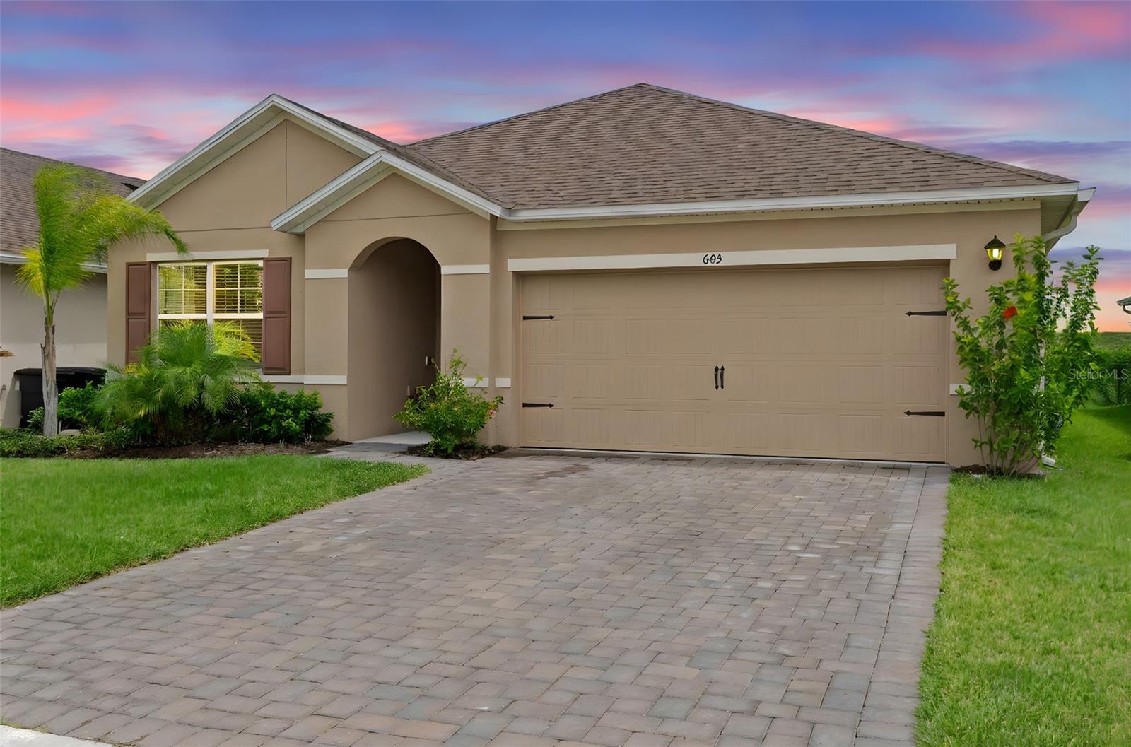 WOW – PRICED TO SELL! This is the lowest-priced home in all of Riviera Bella, DeBary’s most exclusive gated community, and First-time homebuyers may also qualify for up to $35,000 through the Hometown Heroes program, making this one of the best deals in Central Florida. Welcome to 603 Lazio Circle, a stunning 3-bedroom, 2-bathroom, 2-car garage home that’s only two years old and feels brand new. Designed with modern upgrades and thoughtful touches, this home features high ceilings, custom accent walls, upgraded baseboards, recessed lighting, and a neutral designer color palette. The open floor plan offers a natural flow between the living room, dining area, and kitchen, creating a spacious feel while keeping each space beautifully defined. The kitchen features stainless steel appliances, granite countertops, 42-inch cabinetry, a custom backsplash, and a large island with bar seating, making it the perfect centerpiece for gatherings. The private owner’s suite offers a feature wall, tray ceiling, a large walk-in closet, and a spa-like ensuite with dual vanities, a soaking tub, and a separate walk-in shower. Two additional bedrooms share a stylish full bathroom, and the home also includes a dedicated laundry room and a two-car garage. Step outside to a covered lanai and low-maintenance yard, perfect for relaxing or entertaining. Riviera Bella delivers a luxury lifestyle with a private boat dock onto the St. Johns River for boating and fishing, a resort-style pool, fitness center, theater, multiple playgrounds, a splash pad, gated security, monthly food trucks, and exclusive year-round community events. This location offers incredible growth, with DeBary’s highly anticipated new downtown district currently under development, bringing new restaurants, shops, and entertainment just minutes away where you ride your Golf cart to. Less than two miles up the road, a brand-new 200+ acre state park is being built, offering miles of trails, outdoor recreation, and natural beauty. Also added is the Florida sun rail to get to Orlando and back for work on Ft Florida. Conveniently located near I-4, this home provides easy access to Orlando, Daytona Beach, shopping, and top-rated schools Debary elementary being A+ rated, while being tucked into a private, secure community. Don’t miss this rare opportunity to own a nearly new, move-in ready home in one of Central Florida’s fastest-growing areas. Schedule your private showing today!