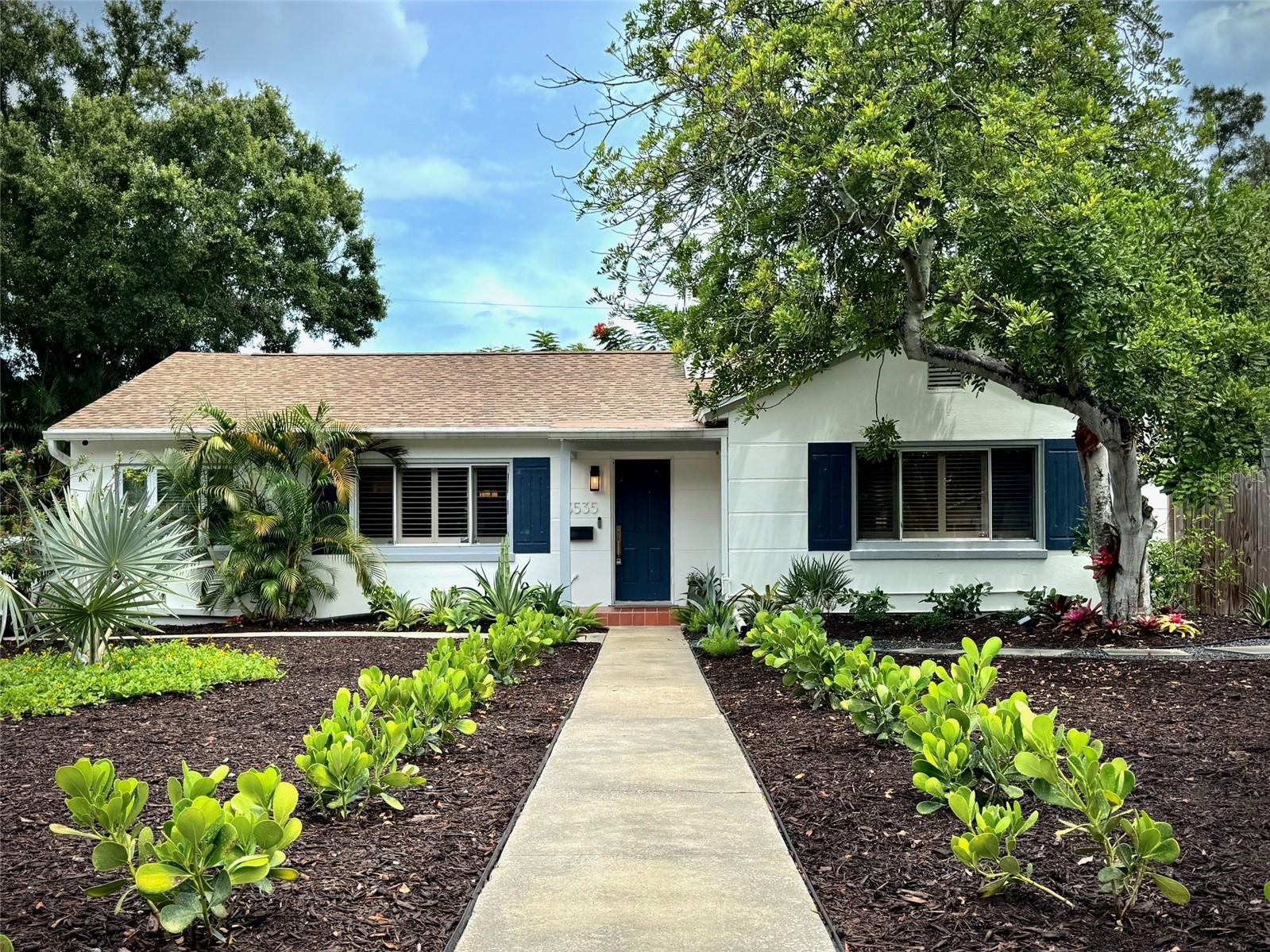 Found in the quiet, leafy streets of northeast St Pete is a crisp, spacious and beautifully appointed home for lease. Front to back and top to bottom, you'll notice this isn't just a rental house, but a well-cared for home. The property is not in a flood zone, is made with concrete block construction, and sits on an oversized 7501 sqft lot. Enjoy gorgeous landscaping, updated fixtures, high-end appliances, oversized front and back yards, crown molding, plantation shutters, and plenty of off-street parking. Through the covered entry-way, find a generous living space, French doors into your bonus office space, dedicated dining off of the large, handsome kitchen, three ample-sized bedrooms, and a newly updated bathroom. Through the double glass doors off of your kitchen/dining area is a courtyard-like setting with native and drought-tolerant landscaping. Also find a one-car garage with newer laundry machines and a paved space with enough room for leisure activites and projects alike. Showings begin Saturday 8/16, ready for move-in beginning 9/15. First month's rent and security deposit due at lease signing. Well qualified applicants only, please!