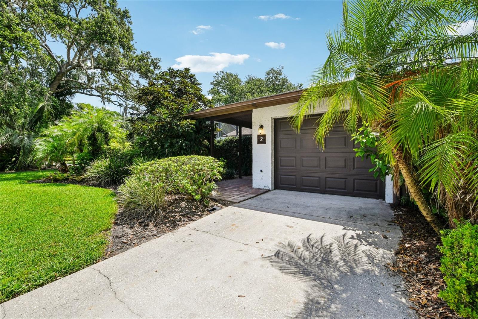 Seller may consider buyer concessions if made in an offer & this property QUALIFIES FOR A CREDIT UP TO $3750 through the seller's preferred lender! Tucked away on a quiet corner in the peaceful Grenelefe Estates community, this updated 2BD/2BA VILLA offers relaxed Florida living with character, comfort, and beautiful WATER VIEWS! Your single story END-UNIT awaits with VAULTED WOOD SLAT CEILINGS, large windows, and an open and airy layout - plus a NEW WATER HEATER (2023), UPDATED A/C (2022), 2016 roof and a 1-car garage. The UPDATED KITCHEN & BATHROOMS shine with modern finishes, while TILE and VINYL PLANK WOOD FLOORING in the main living areas pair nicely with the NEW CARPET in the bedrooms. Both bedrooms offer en-suite bath access, and a BONUS/FLEX space provides a perfect home office or hobby nook. Step into the FLORIDA ROOM overlooking the canal affectionately known as “Lake Abbey” and your private spot for coffee, reading, or enjoying the lush green space and canal front views. A courtyard style entrance adds charm and privacy, while the rear patio invites outdoor living or dining by the water. You will also appreciate a nice assortment of community amenities and gated access for residents off Kokomo Rd. Located just 8 miles from Haines City and near Marion Rd, US 17, US 27, and I-4, this villa offers the perfect blend of tranquil living with easy access to shopping, dining, and Central Florida attractions. You are also not far from larger Lake Marion for fishing, boating, or peaceful views. This adorable villa is one of Polk County’s best kept secrets – call today to schedule a tour and come experience life at Grenelefe Estates!