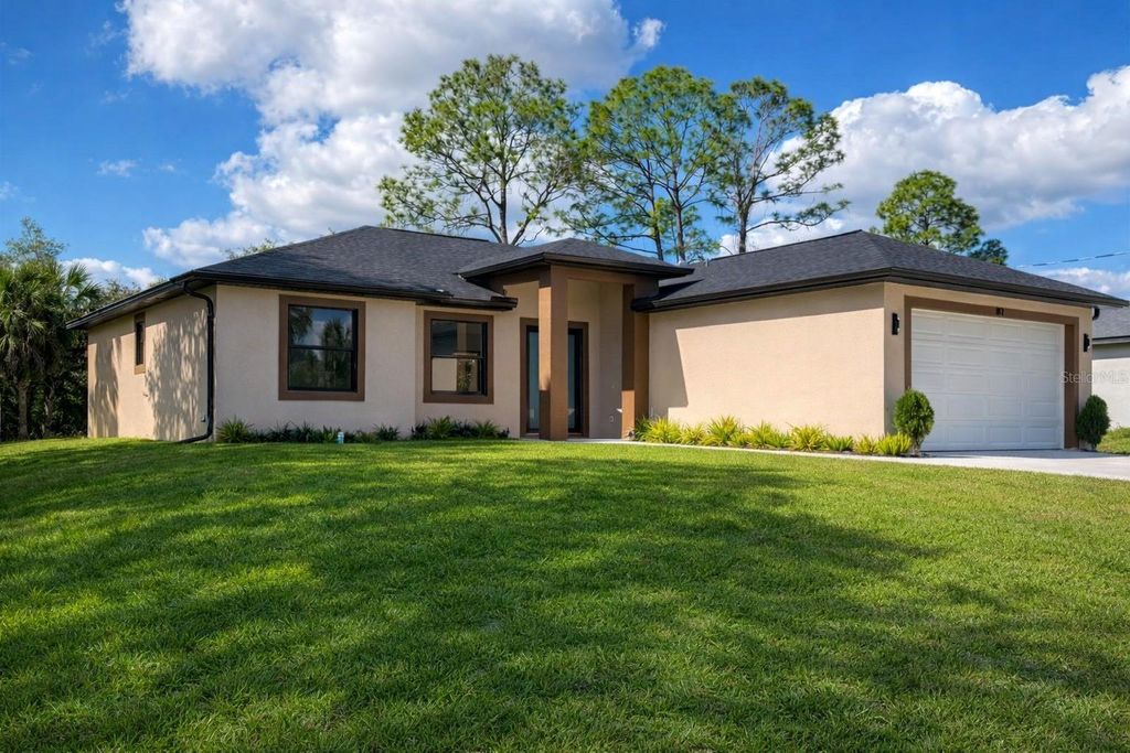 Photo of 81 Flamingo Boulevard, Port Charlotte, FL 33954 (MLS # TB8404545)