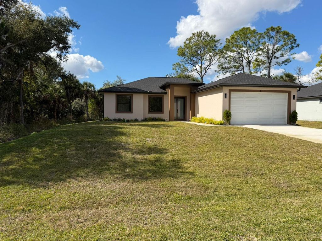 Photo of 81 Flamingo Boulevard, Port Charlotte, FL 33954 (MLS # TB8404545)