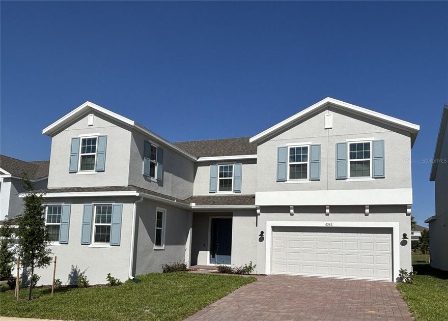 Don't miss your final opportunity to own the exceptional Palmer plan backing to a beautiful park area in Trinity Lakes!  Discover the perfect blend of style, comfort, and functionality in this exquisite plan, a stunning open-concept home featuring 5 spacious bedrooms, 3 full baths, 2 half-baths, plus a private attached Casita, with separate entrance, including a bedroom and full bath—ideal for guests or multi-generational living. Elegant Luxury Vinyl Plank flooring enhances the 1st floor main living areas, while 9'4" first floor ceilings, and 5¼" baseboards throughout add a touch of sophistication. The gourmet kitchen boasts stylish quartz countertops, 42" upper cabinetry with crown molding, sleek tile backsplash, stainless steel appliances including cooktop and built-in double oven, and a center island perfect for entertaining. A bright Great Room flows effortlessly to the covered lanai, creating a seamless indoor-outdoor living experience. Upstairs, a spacious Gathering Room provides extra space for relaxation, and the luxurious Primary suite impresses with a private sitting area and ensuite bath featuring dual walk-in closets, a garden tub, separate vanities, and a stunning walk-in shower with upgraded wall tile surround, rainhead fixture, and frameless glass enclosure. Complete with brick paver driveway and attractive landscaping, this home combines modern elegance with everyday convenience—perfect for today’s lifestyle. Trinity Lakes offers incredible amenities with a fantastic resort style pool, splash pad, multiple playgrounds, dog park, walking trails, fishing pier and a fitness center. All of the schools are located within ten minutes of the community, and shopping and dining are just a short drive away.