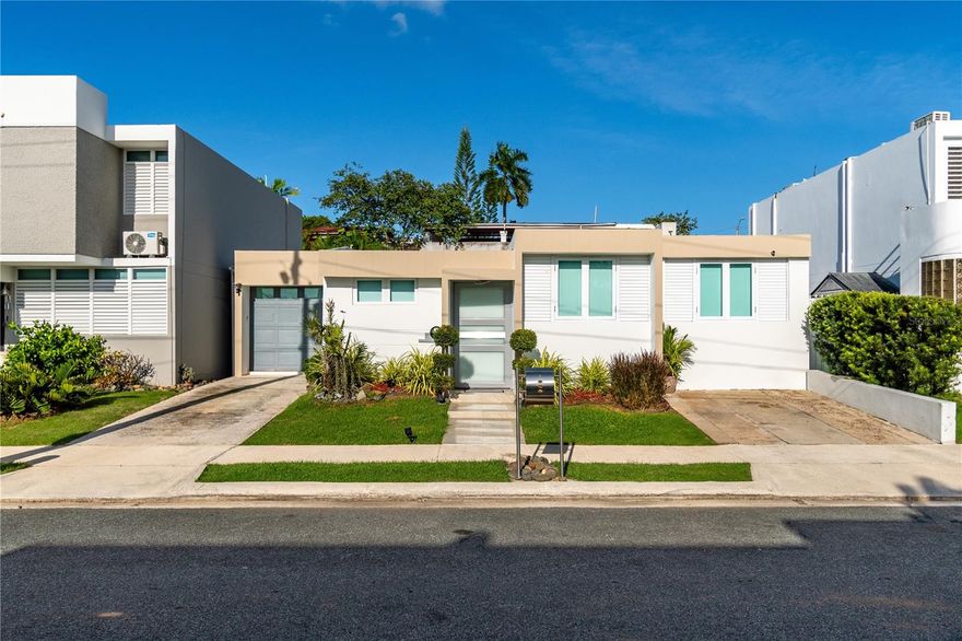 Elegant single-story residence in Prado Alto, Guaynabo, completely renovated and move-in ready. The main house features 3 bedrooms and 2 bathrooms, and in the back, there is an additional room with a full bathroom and a private entrance through the patio — perfect for hosting family or guests.

With 1,874 sq. ft. of construction and a 377 m² lot, you’ll enjoy a spacious and comfortable home with a cozy patio, ideal for outdoor relaxation. The property is equipped with a water cistern and generator, providing convenience at all times.

Prado Alto offers excellent amenities: playground, basketball, tennis, and soccer courts, a gazebo, and 24/7 security, supported by an HOA fee of $105 monthly. Located in a privileged area, just minutes from supermarkets, schools, restaurants, and much more. Call now to schedule a showing