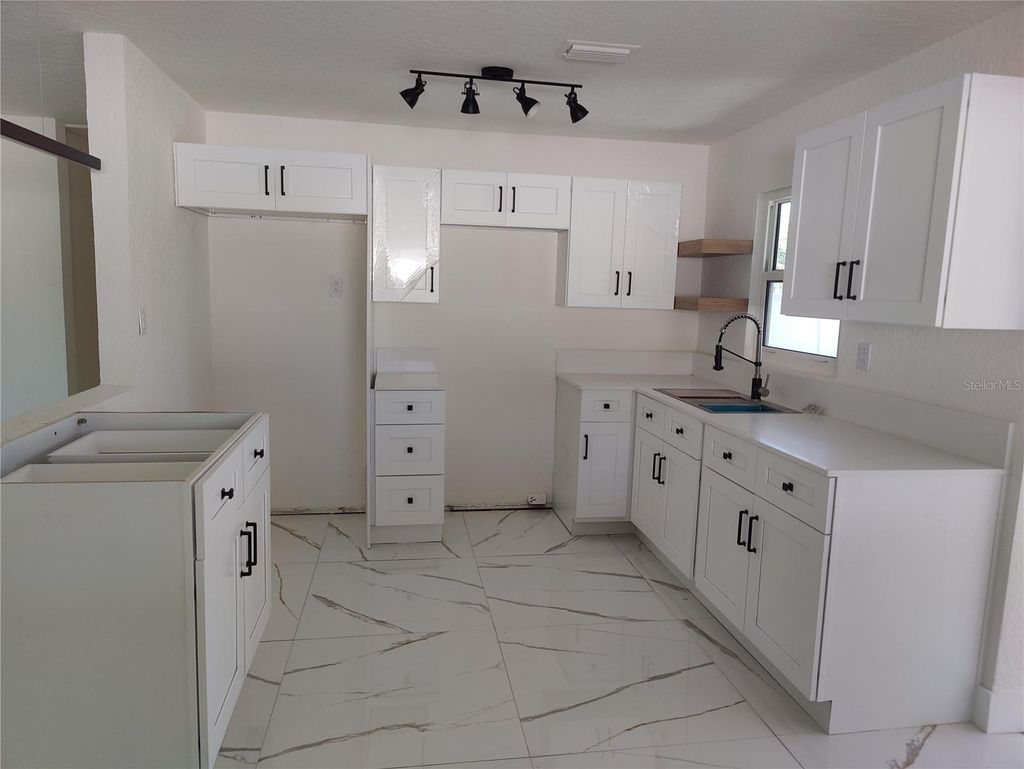 Photo of 7498 Orpine Drive N, St Petersburg, FL 33702 (MLS # TB8491832)