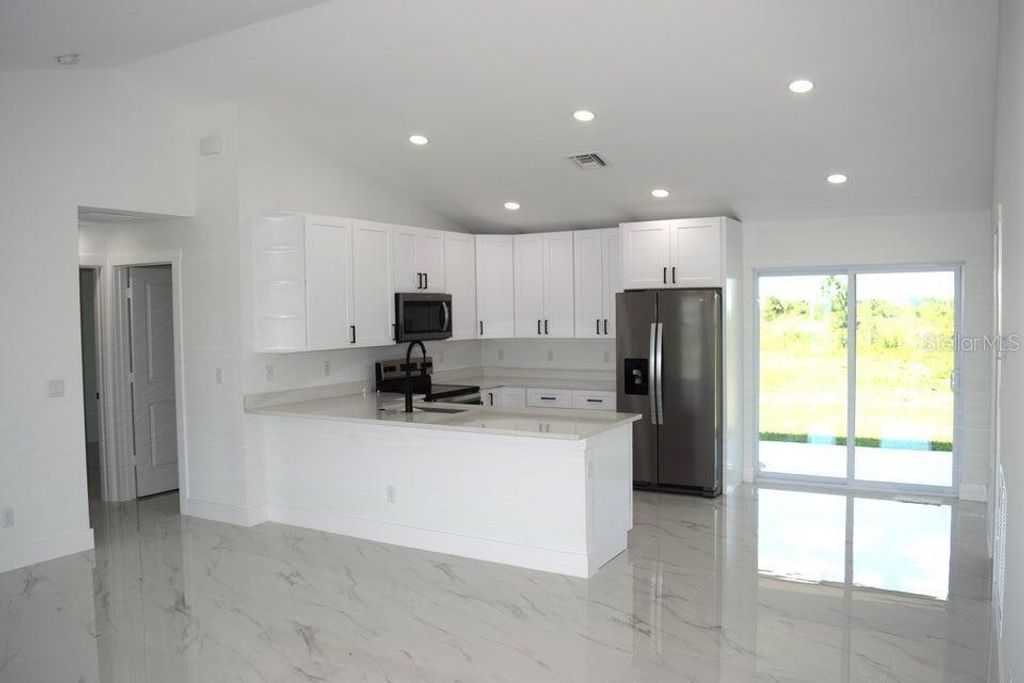 Photo of 7542 NW 83rd Court, Okeechobee, FL 34972 (MLS # OK225781)