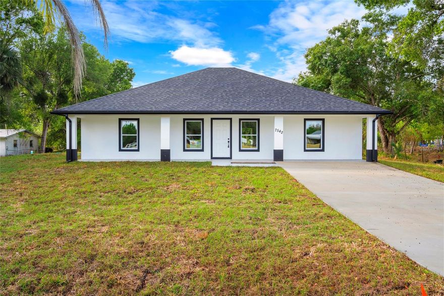 Coming Soon! Beautiful brand new 3 bedroom, 2 bath CBS home in Dixie Ranches featuring 10-foot ceilings and a spacious covered front porch perfect for morning coffee and sunset views. The kitchen offers tall wood cabinets, quartz countertops, and stainless steel appliances. Interior highlights include tile floors throughout, tiled showers, and sleek black fixtures. Enjoy backyard views from the covered rear porch, with the added bonus of a neighboring lot behind the home that's also available — perfect for extra privacy or future expansion. Combined, both parcels offer the potential to own over 0.7 acres. Impact windows, central A/C, custom closets and doors complete this move-in ready property. Plenty of room for your boat, RV, or toys. Conveniently located near town and shopping. Must see to appreciate