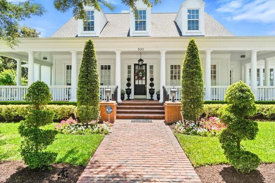THE 'Welcome to Our Magical Town' Home, in the Heart of Celebration! 
This Estate Showcase Home has had a total Renovation with Architectural precision to create a center of warmth and belonging. With an Open Floor Plan, Luxury Porcelain Tile Flooring, Soaring Ceilings, Distinctive Carved Crown Molding and Windows (Subtle carved Hidden Mickeys). To the left is an Open Living room/ library. To the right is the Open Dining Room with custom wainscoting & crown molding. The expansive Open Living Area has a sparkling electric Fireplace. It has a Full View of your Private rear Pool Retreat, with Rock Water Slide, a covered Cabana (plumbed and with gas lines for an outdoor kitchen). A quiet place for meaningful conversation or to grill. The Pool, with its NEW equipment, is heated, has a modern salt purification system, and a solar, sun shelf, a Hot-Tub spa with a mini waterfall, Color changing LED lighting creates a magical ambiance! There is a private pool bath & outdoor shower too! Mature Palm trees and designer landscaping. Makes this a place to escape and reconnect with nature. The Covered Lanai offers an electric screen to extend your entertainment area and a Central Controlled Sound System. Dream Kitchen has everything needed for you and your chef(s) for a wonderful 'foodie' experience: an expansive island of luxury porcelain with waterfall countertops & coordinated backsplash, counter dining for 5, 2 sinks, Induction Stove Top, Thermidor Refrigerator, Double ovens, 2 Dishwashers, Wine Fridge, separate Ice Maker, Bosch Coffee and Espresso bar, Soft Close drawers and a large Pantry Cabinet, a cozy place to read the paper or finish a computer project, there is a custom bench with a Mickey Dining table!  Off the Kitchen is a Secret Door to a large, full windowed Private Home Office with a view of the Golf Course! The Main floor Laundry Room has Quartzite counters, and a TV! Off the Kitchen is a first floor Guest Bedroom with a connecting FULL Bath to the Office. A back Staircase off the kitchen leads to a Guest Suite with a kitchenette, and a remodeled full bath. The main floor Primary Bedroom Suite with a full view of the Pool area offers a huge closet with custom cabinetry, a morning Bar & Kitchenette. The Primary Bath is re-designed with a huge walk-in Shower, light-up rain shower, body jets and Porcelanosa tile floors & walls, wall mounted TV &TOTO Smart Toilet. A Powder Room has a TOTO Toilet with a Surprise Mickey Feature. A staircase with skylight, leads to the second level with an Exercise Room/Theater Room: Custom Marley flooring suspended 'Stage-step' sub-flooring, fitness dance barre & mirrored wall. This room can be used as a Theatre Room!  A second Laundry Room is located off the hallway between the Two Additional large Bedrooms; each with its own private bath and large closets.
A Three Car Garage With work area that is separate from the parking spaces, shelving, suspended storage racks, and epoxy floors, and additional Outdoor Multi-space parking and a side parking pad!
This “Lock and Leave" Home allows you to enjoy a maintenance-free active or relaxed Lifestyle. Just a short stroll or bike ride to Amenity-Rich Celebration: Restaurants, Boutiques, Banks, Offices, the Celebration Hotel, Parks, Walking & Biking trails, the Celebration Golf Course, Splash Fountains, the Sunday Farmer Market, Heated Resort style Pool, Gated Tennis Courts & Playgrounds and Lake Rainhard in the middle of it all!