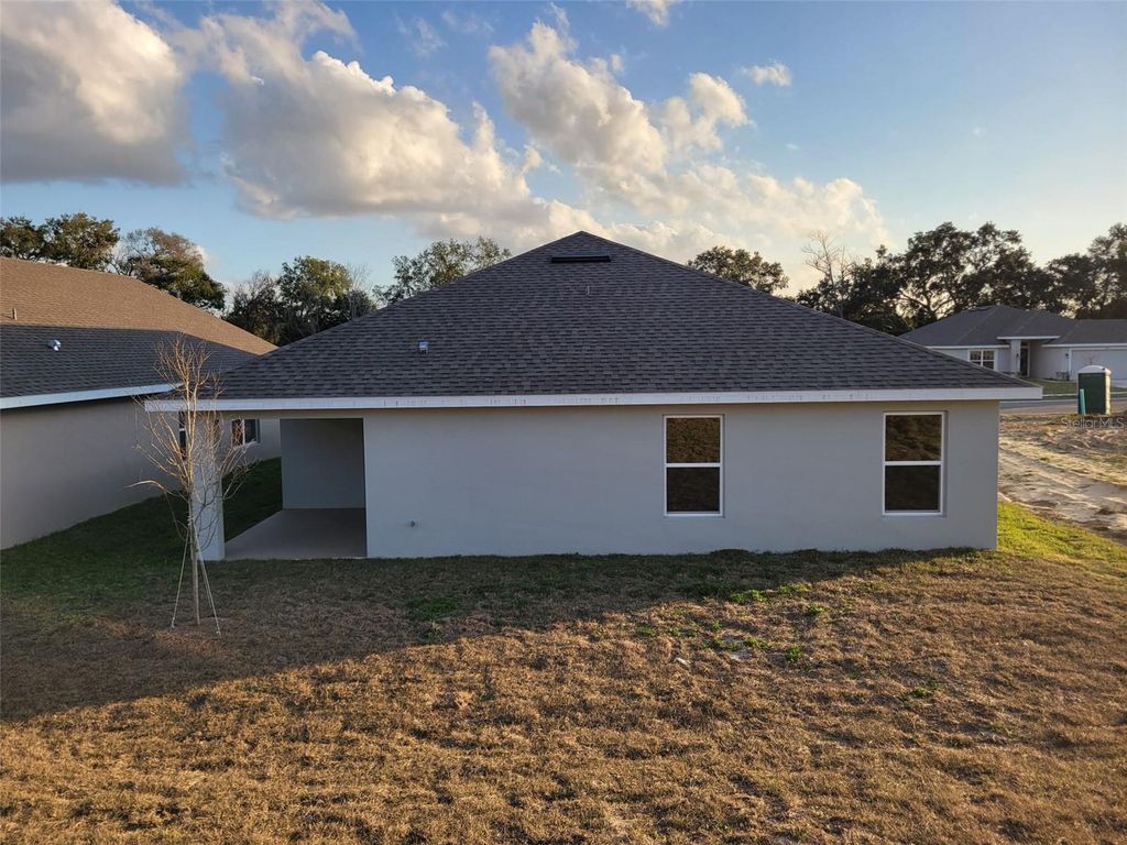 Photo of 1627 Ann Rose Way, Leesburg, FL 34748 (MLS # O6376436)