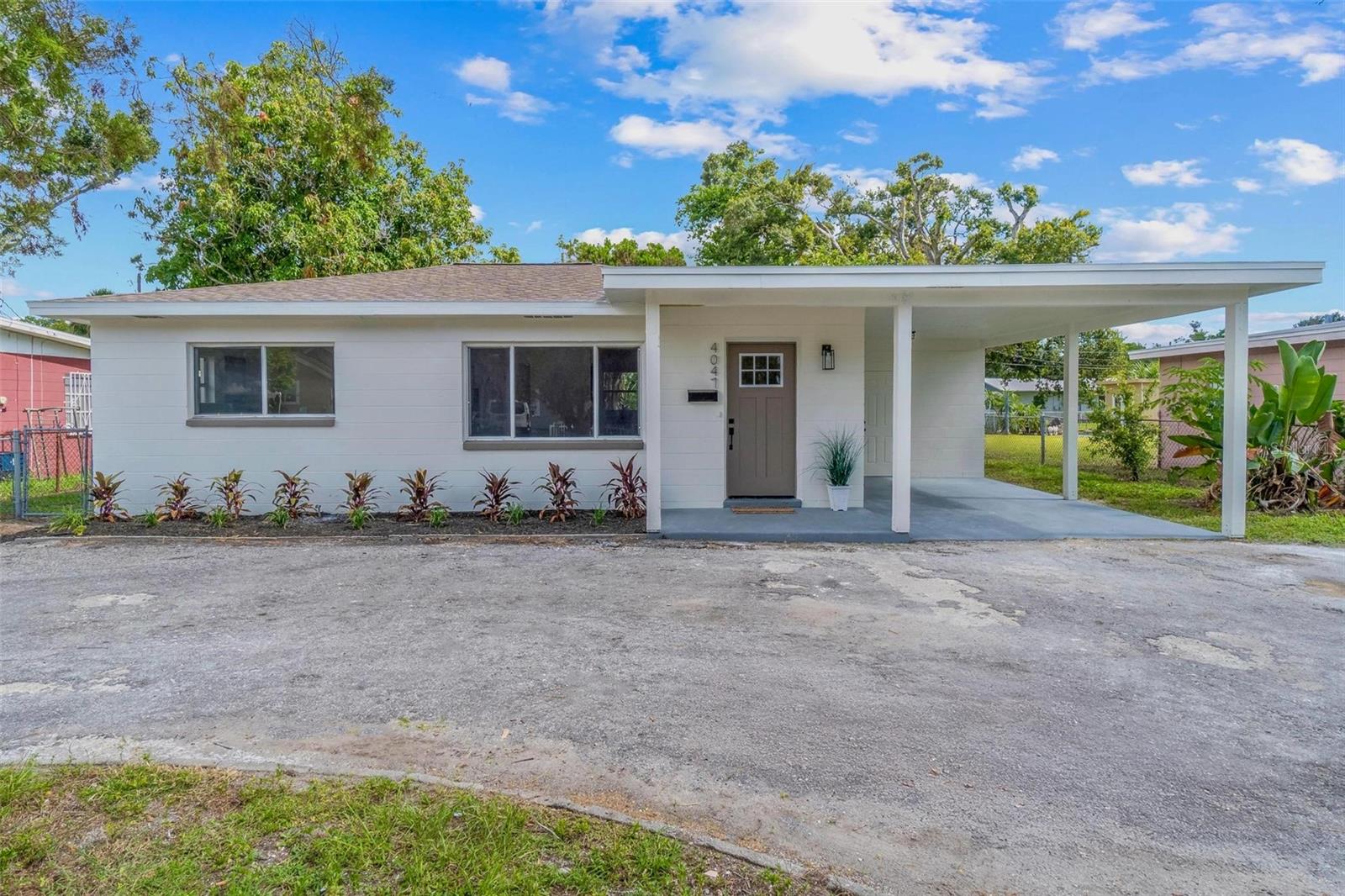 Welcome to this stunningly remodeled 3-bedroom, 1-bathroom residence, ideally located HIGH & DRY in St. Petersburg, yet only a short bike ride from the vibrant Gulfport waterfront & Arts District! Thoughtfully updated from top to bottom, this home offers peace of mind and modern comfort with a NEW roof (2025), NEW hvac system (2025) and stylish designer finishes throughout. Step inside and enjoy a bright, open floor plan filled with natural light—ideal for both relaxing and entertaining. The fully renovated kitchen features a spacious island, sleek quartz countertops, modern shaker cabinets, and brand-new stainless-steel appliances. Just off the kitchen, a screened-in patio invites you to unwind and enjoy the outdoors in your fully fenced backyard—perfect for pets, play, or gatherings. One of the bedrooms includes an adjoining utility room with indoor laundry, offering extra flexibility and function. On the opposite side of the home, you'll find two additional bedrooms and a completely remodeled bathroom showcasing elegant tile finishes. Fresh interior and exterior paint enhance the home’s bright, modern aesthetic, while recent system upgrades ensure comfort and reliability for years to come. Don’t miss your opportunity to own this turnkey home — schedule your showing today!