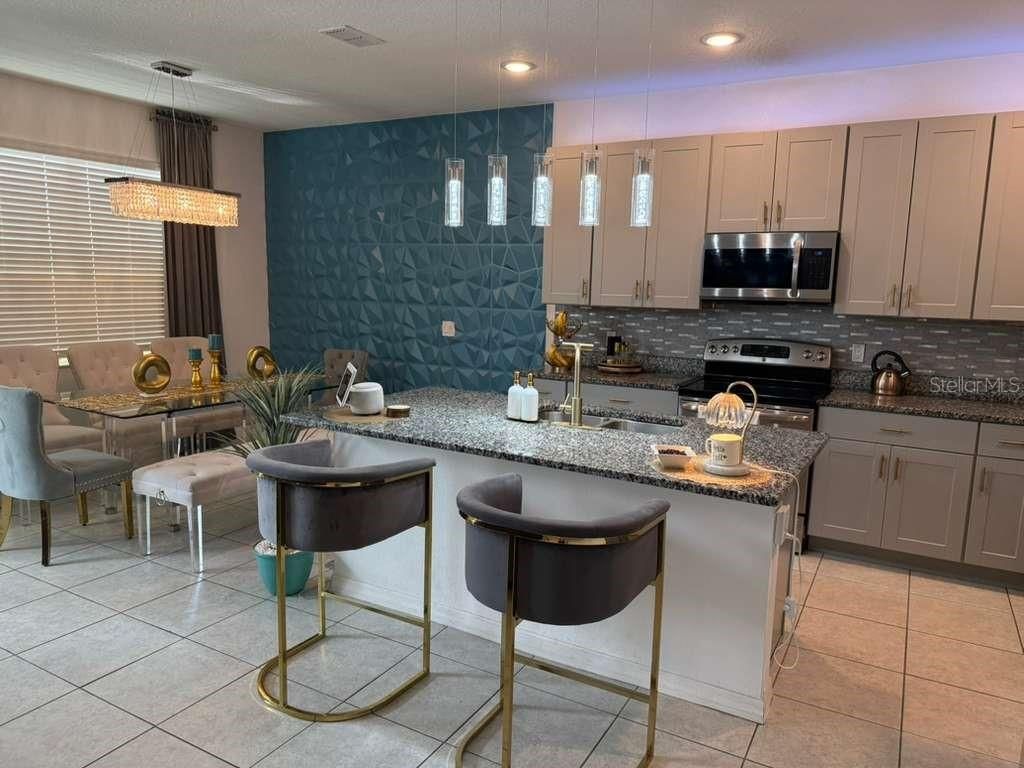 Photo of 570 Feltrim Manor Road, Haines City, FL 33844 (MLS # O6400486)