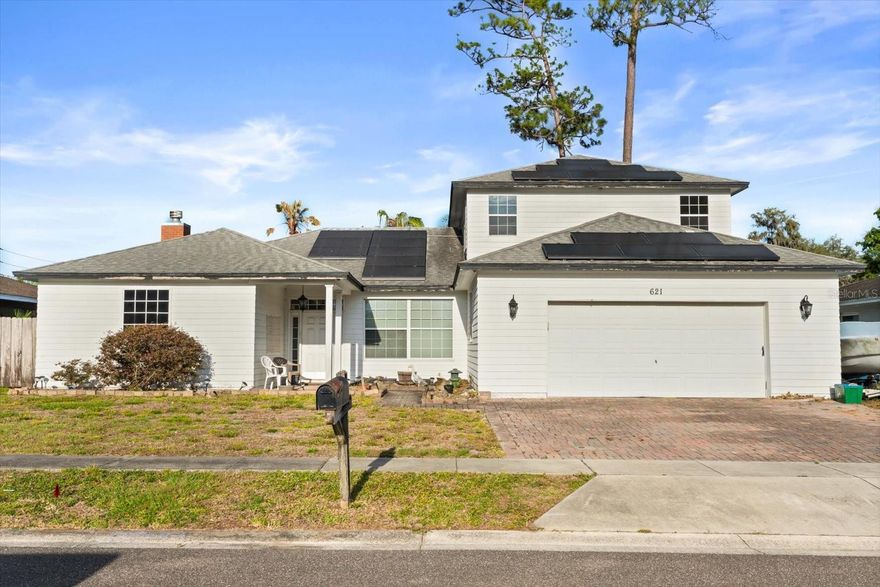 Welcome to 621 Prairie Ln, a spacious two-story home in Altamonte Springs with a practical layout, wood flooring, and abundant natural light throughout. The living room offers a welcoming central gathering space with a brick fireplace, ceiling fan, and large front windows. Nearby, the kitchen provides tile flooring, ample cabinetry, recessed lighting, dark countertops, and a breakfast bar, with the dining area positioned just to the left for an easy everyday flow. The primary suite includes bay-style windows, a ceiling fan, and an en suite bathroom with a walk-in shower, while the secondary bedrooms offer comfortable flexibility for guests, work, or everyday living. Upstairs, the unfinished bonus space is a true blank canvas with exciting potential for a large extra bedroom, expansive primary suite, studio, recreation area, or future finished living space, depending on the buyer’s needs. Outside, the covered rear patio with ceiling fans overlooks the fenced backyard and storage shed, creating a functional outdoor area with room to relax, entertain, and enjoy Florida's indoor-outdoor living. Conveniently located near major roadways, including SR 436, US-17/92, and I-4, this home offers easy access to shopping, dining, everyday conveniences, Altamonte Mall, Cranes Roost Park, and surrounding Central Florida destinations.