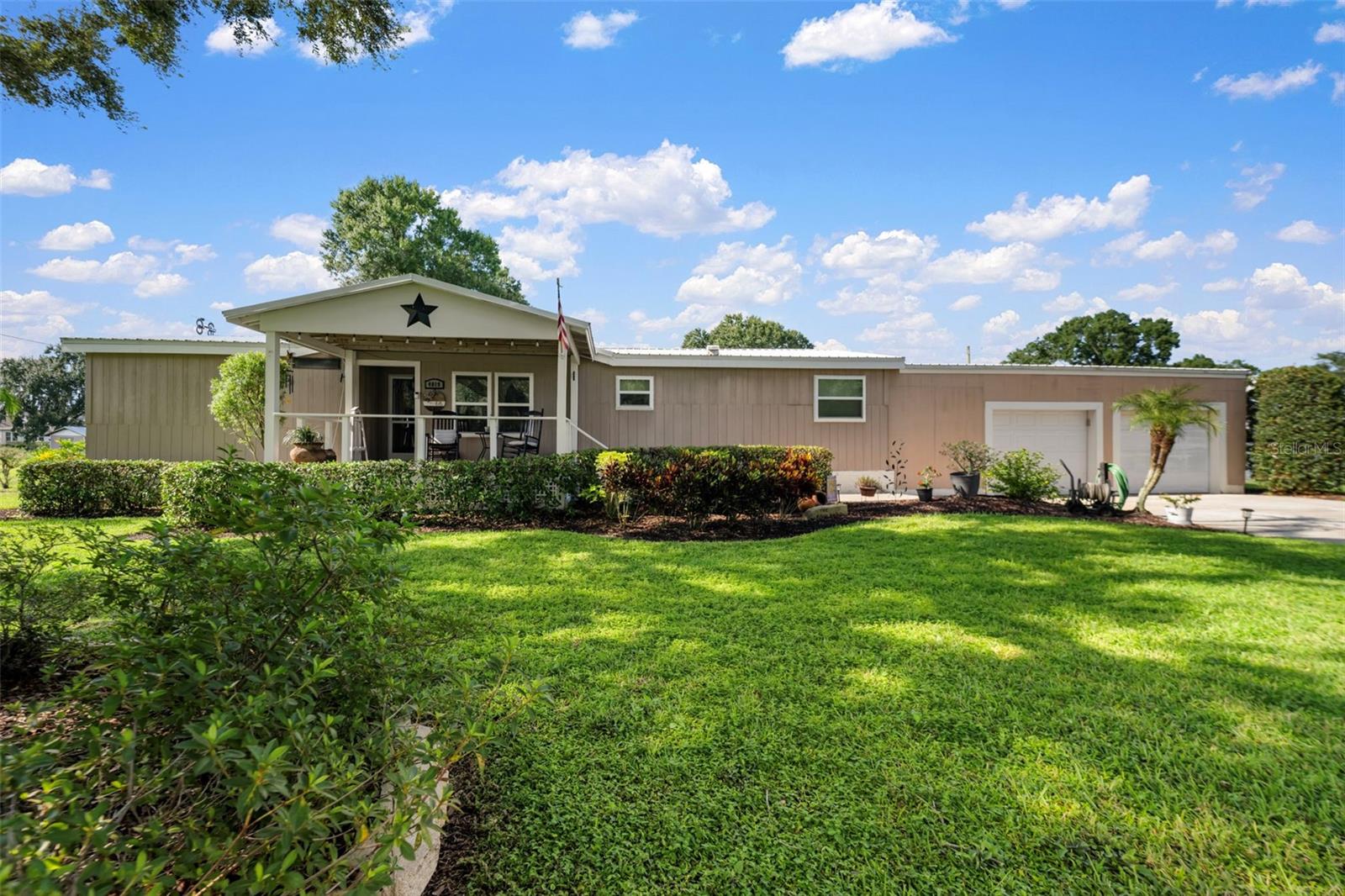 Step inside this beautifully maintained 3-bedroom, 2-bath home, where charm meets functionality on nearly an acre of land. A paved driveway leads to the spacious 2-car attached garage, surrounded by lush, well-maintained landscaping. Relax with your morning coffee on the inviting front wooden porch, or unwind on the screened back porch overlooking the backyard. Summers are a splash with the above-ground pool, and RV hookups make this property perfect for travelers or guests.
Inside, you’ll find a warm and welcoming layout with a stylish kitchen featuring stainless steel appliances, a center island, and plenty of cabinetry. The cozy living area is accented by wood panel details, while the primary suite offers a soaking tub, double vanities, and a walk-in shower. With generous indoor and outdoor living spaces, this home is ready for you to move in and start making memories.