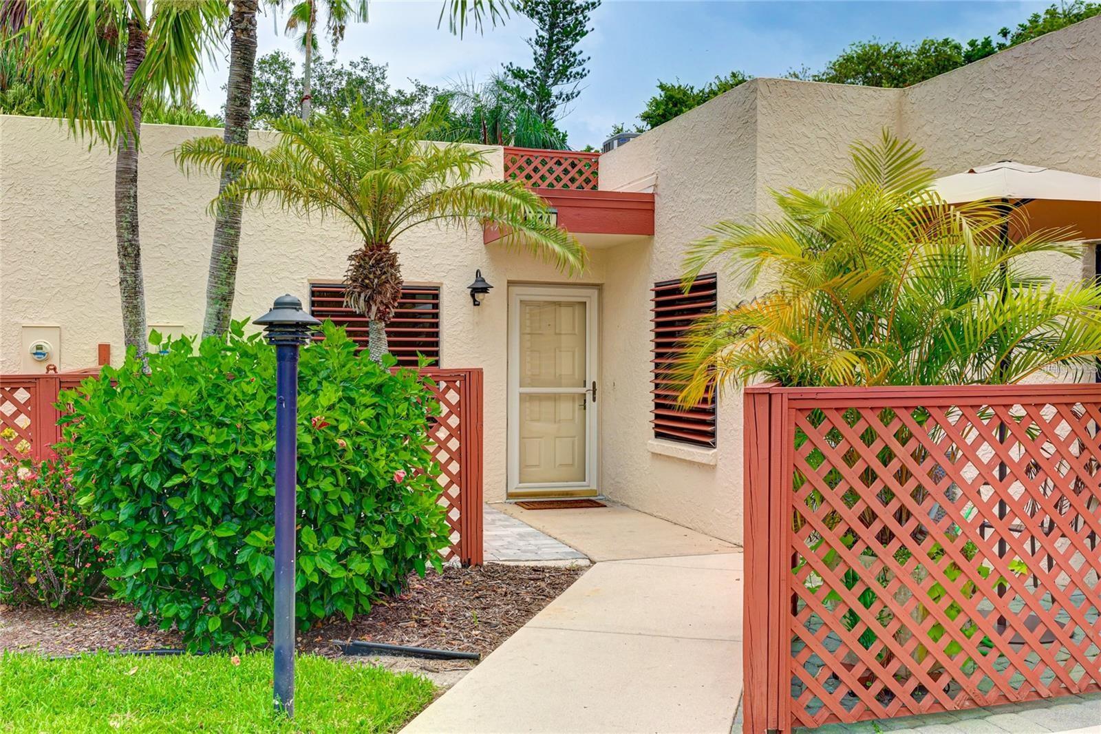 One or more photo(s) has been virtually staged. Nature Lover’s Paradise with an Enchanting Private Lanai!
One of the most captivating features of this villa is the expansive 300 sq ft private screened lanai, accessed through three sliding glass doors—from the living room, the third bedroom/office, and the primary suite. Nestled in a designated Bird Sanctuary, this tranquil retreat invites daily visits from cardinals, mockingbirds, woodpeckers, egrets, ibis, blue jays, brown thrashers, and more. Whimsical squirrels and other local wildlife add to the charm, making this space a true sanctuary for nature lovers.
At the front of the home, a welcoming patio is perfect for enjoying morning coffee or an evening wind-down. Both the kitchen and second bedroom overlook this serene area, filling the home with natural light and a peaceful ambiance.
HOA dues include a wide range of services: internet, WiFi, two cable hookups, exterior maintenance, and building insurance, along with other valuable amenities including community pools, tennis and pickleball courts!
Located just 1 mile from IMG Academy, this home is ideal for families involved with the renowned sports training facility. Parents often choose to stay nearby. Additionally, the Ringling College of Art and Design—a magnet for creatives from around the globe—is just 20 minutes away, adding even more appeal.
This villa offers a rare combination of natural beauty, everyday convenience, and cultural connection. Don’t miss your opportunity to make this special home your own!