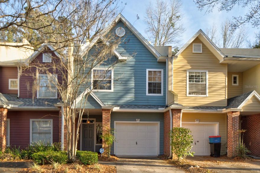 Discover comfort and convenience in this well-maintained 3-bedroom, 2.5-bath townhome located in the sought-after Monticello at Mill Pond community—just minutes from the University of Florida, Ben Hill Griffin Stadium, and UF Health. The kitchen features sleek granite countertops, modern stainless steel appliances, and classic white cabinetry. Throughout the home, you’ll find soft, neutral tones from a fresh repaint in 2024, updated lighting, and detailed crown molding. This home also features a 2025 installed roof, a 2023 AC unit, a 2024 hot water heater, and a 2023 primary bathroom shower upgrade. Each bedroom is generously sized, filled with natural light, and offers plenty of room to relax or work from home. Enjoy the attached 1-car garage with extra storage, a dedicated driveway space, and ample guest parking. The rear patio opens to a quiet green space—ideal for unwinding or entertaining. Residents have access to a well-kept community pool and are just moments away from shopping, dining, and recreational options. This is a standout opportunity in one of Gainesville’s most accessible neighborhoods.