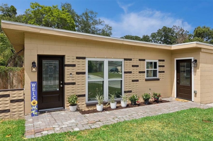 Welcome to this beautifully reimagined mid-century inspired residence in the Fernway Community minutes from Downtown Orlando! Ideally situated just off Bumby Avenue, this home offers unbeatable convenience—just minutes from the 408 Expressway and I-4 interchange, and only 15 minutes to Orlando International Airport. 

Completely rebuilt from the studs in, this home is essentially brand new from the exterior walls inward. Every detail has been thoughtfully upgraded, blending modern style with peace-of-mind improvements.

Step inside to discover stunning luxury vinyl plank flooring throughout, complemented by fresh interior and exterior paint. The open and inviting layout features a fully remodeled bathroom and a versatile third bedroom that can easily serve as a home office or den.

The kitchen shines with newer stainless steel appliances, while newer windows and sliding glass doors fill the home with natural light. Additional upgrades include:
 • New energy-efficient split AC system
 • Upgraded plumbing throughout
 • Upgraded 200-amp electrical service
 • Tankless water heater for endless hot water
 • New fiberglass entry doors withlead glass inserts

Outside, enjoy a freshly installed lawn with a Rain Bird irrigation system, essential for maintaining lush Florida landscaping year-round. A large unfinished shed in the backyard offers endless potential—create a workshop, studio, or your own private retreat.

Location is everything, and this home delivers:
 • Minutes to downtown Orlando dining, entertainment, and nightlife
 • Easy access to I-4 and 408, and Orlando International Airport for commuting
 • Close to major hospitals, shopping, Target, and Publix
 • Walking distance (approx. 4 blocks) to Pershing K-8
 • Zoned for Boone High School (Go Braves!)
 • Steps from Fort Gatlin Recreation Complex featuring a pool, tennis courts, and expansive park

No HOA and priced to sell, this is an incredible opportunity to own a completely renovated home in one of Orlando’s most desirable and convenient locations.