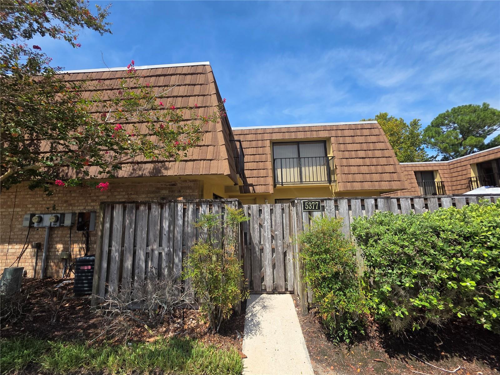 Fantastic townhome-style condo in the heart of Orlando—just minutes from The Mall at Millenia, Universal, Valencia College West, and countless attractions! This home features stylish updates, including new flooring throughout, refreshed bathrooms, and a newer A/C for comfort. Both bedrooms are upstairs with private balconies, while downstairs offers a convenient half bath and laundry. Enjoy two sets of sliding doors that open to a pavered private porch—perfect for entertaining or your own private retreat. Community offers clubhouse, pool, tennis court and racquetball court. Don’t miss this opportunity, contact us today to schedule showing.