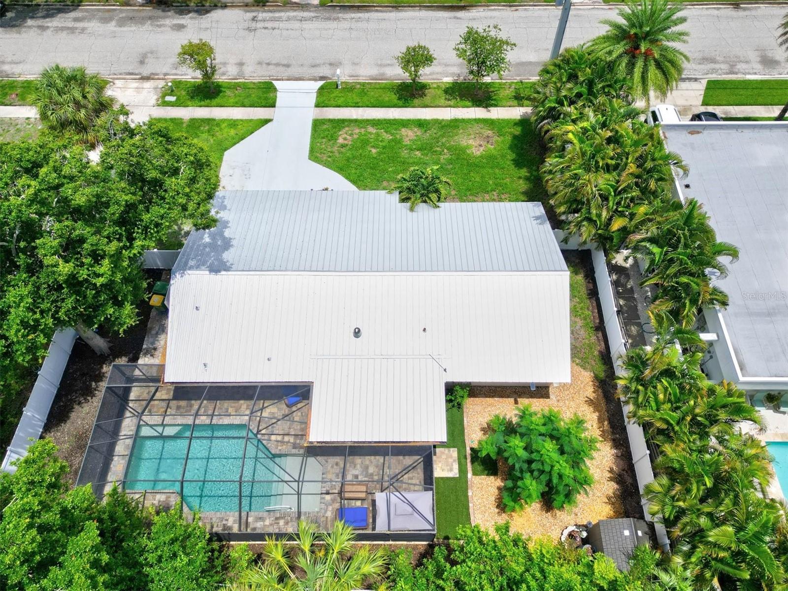 Welcome to the "Hangout on Hyde" where comfort, privacy & fun collide! We are a fully renovated, turnkey furnished, beach inspired, 3 bedroom 2 bath heated saltwater pool home w/ outdoor kitchen located just 2 miles from Siesta Key in the Arlington Park neighborhood. We are a pet friendly home with a fully fenced backyard and private screen enclosed lanai allowing you to enjoy meals outside at our newly added outdoor kitchen w/ separate covered outdoor grilling station. Enjoy free wifi, streaming & on site laundry. The Master Bedroom offers a King bed, Smart TV, 2 nightstands and a dresser as well as a newly remodeled en suite bathroom. The Guest bedroom also offers a king bed, 2 nightstands, a dresser and Smart TV. The third bedroom offers a twin over twin bunkbed with pullout trundle as well as a full size arcade game with over 4000 games and a Smart TV.