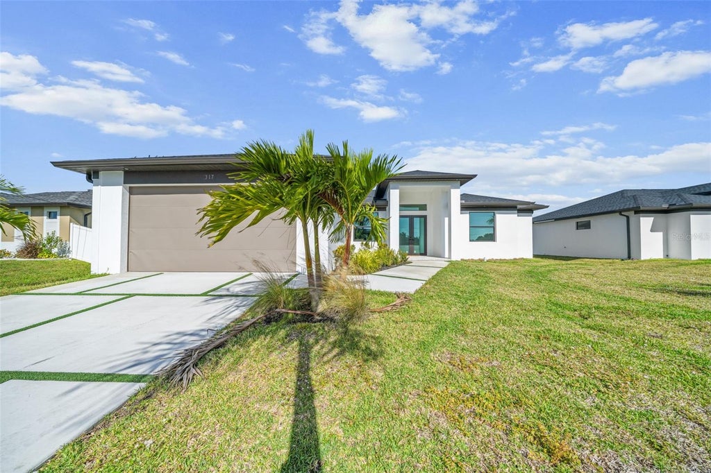 Photo of 317 NE 15th Terrace, Cape Coral, FL 33909 (MLS # O6450537)
