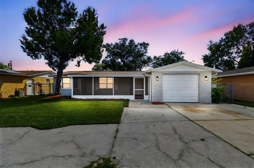 Welcome to this NEWLY REMODELED 3 bedroom 2 bath home with 1,252 heated and cooled square feet, and over 2051 total square feet including your private outdoor sitting areas. Enjoy main level living at its best with this one-story block & stucco home. The modern design includes new appliances, kitchen island, bathrooms with stunning tiled showers, vinyl plank flooring throughout the whole home, ceiling fans and recessed lighting. There is also plenty of natural light flowing through the open floor plan. Both the screened lanai inside the private fenced yard, and the screened in front porch add to the home’s flow between indoor/outdoor living spaces. Because there is no HOA, you keep all of the flexibility without HOA restrictions. One car garage with the circular driveway allows for 5 parking spaces. Come tour your new home in Holiday Florida right away!