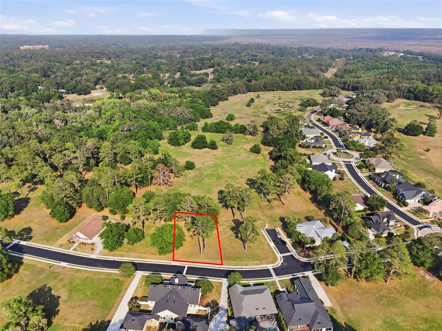 Build the custom home you've always envisioned on this stunning lot nestled within the exclusive, gated community of Savanna Pointe. Mature trees dot the landscape, offering natural beauty and privacy. Sip your morning coffee on the front porch and soak in the serenity, or stroll along the sidewalk through this sought-after enclave of luxury residences. Perched on the edge of Paynes Prairie, Savanna Pointe offers something truly unique — a private golf cart path with direct access to the Gainesville Country Club. The location couldn't be more convenient, with UF Health, the University of Florida, and the VA Medical Center all within approximately 5 miles. When it's time to shop or dine, Celebration Pointe and Butler Plaza are just 3 miles away, and quick access to the I-75 corridor makes getting around a breeze. This is an open builder lot with a minimum build requirement of 1,500 sq ft — your blank canvas awaits. Contact us today to schedule your private tour.