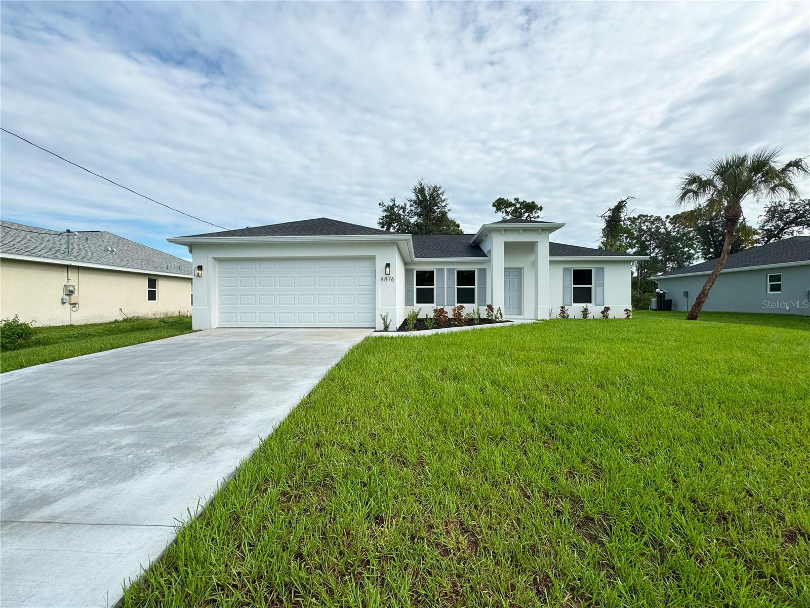 One or more photo(s) has been virtually staged. Beautiful New Construction Home Available Now! Everything is Included and Everything is Upgraded! Starting with an open, split floor plan with vaulted ceilings, this home has Hurricane Impact, insulated, low e windows, full overlay cabinets, stainless steel kitchen appliances, quality stone countertops and window sills, porcelain tile throughout, 30-year shingles, 3 zone sprinkler system, screened lanai, brand name plumbing and electrical fixtures, fully sodded and landscaped. This home has been built to keep insurance, maintenance and utility costs low. Preferred lender is offering up to $1,500 in closing cost assistance! Take a tour through of one of our Beautiful Homes: https://youtu.be/SFsL-Aell24