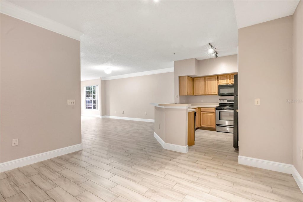 Photo of 13015 Plantation Park Circle #1023, Orlando, FL 32821 (MLS # O6451131)