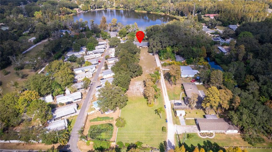 WOW!!! LAKE HOUSE!!! This Lakefront retreat home is private to RESIDENTS ONLY! Great for fishing, boating, kayaking, jet skiing, paddle boarding and so much more right from your very own backyard. All nestled on over 1.5 acres plus the extending lot line is well into the Lake for better control of your waterfront property. This unique location is so tranquil, quiet and offers lots of privacy all at the end of a dead-end Street with no deed restrictions. This beautiful ALL BRICK home features: 3 bedrooms, 2 full bathrooms, covered parking, gorgeous brick fireplace, Corian countertops, Brand New HVAC system, huge 24X12 formal dining room, coat closet, lake views from master bedroom suite, all title eat-in kitchen area, lots of kitchen cabinets, snack bar area, separate large stainless steel double kitchen sink, large utility room, outdoor security lights, Culligan water softener system, two outdoor storage sheds, outdoor BBQ pit, tile front foyer area, and so much more! NO HOA! NO DEED RESTRICTIONS! NO CDD FEES! LOCATION is simply unbeatable! Conveniently located in the desirable Lutz area close to Dale Mabry Hwy a main Tampa city highway, to access retail, restaurants, Veterans expressway/589 which provides rapid access to downtown, airport, world famous beaches, highly A+ rated Steinbrenner high school, Wiregrass, Tampa Outlet Malls, International Plaza, I-75/Interstate 275, hospitals, Busch Gardens, USF, Moffit, culture and sport events in the Tampa and St. Petersburg area. COME ENJOY LAKESIDE LIVING ALONG WITH FLORIDA’S LIFESTYLE AT ITS BEST!!!