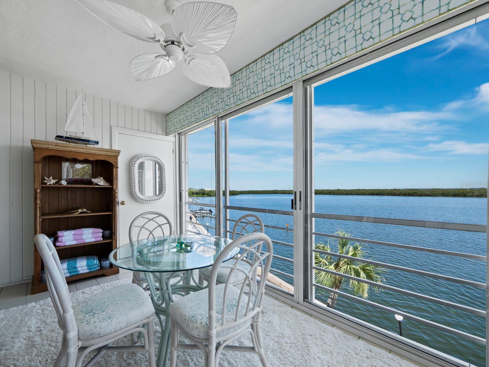 Enjoy breathtaking water views from most rooms in this beautifully renovated top-floor 2-bedroom, 2-bath condo located on the 3rd floor of the highly desirable Longboat Harbour community. Styled with a touch of French flair, the interior features plush velvety carpet throughout—luxurious underfoot and easy on the knees. The kitchen is outfitted with sleek stainless steel appliances, and both bathrooms have been tastefully updated. Impact windows provide peace of mind, and a stacked washer and dryer are conveniently located inside the unit. Offered fully furnished, this home is completely move-in ready. Longboat Harbour is a vibrant waterfront community offering resort-style living. Residents enjoy access to four heated pools, a well-equipped fitness center, sauna and locker rooms, as well as billiards and game rooms. For outdoor recreation, there are shuffleboard, tennis, and pickleball courts, along with a fishing pier. The community also has a full-time on-site manager for added convenience. Boating enthusiasts will appreciate the available docks that accommodate sail and power boats up to 34 feet on a first-come, first-served basis for an annual fee. There is additional storage for bikes and kayaks, and members are welcome to join the Longboat Harbour Yacht Club, which hosts a variety of social activities. All owners enjoy deeded access to a private beach directly across the street, complete with restrooms, picnic tables, indoor showers, and beach chair storage. Ideally located mid-key, this home is convenient to everything Longboat Key has to offer.