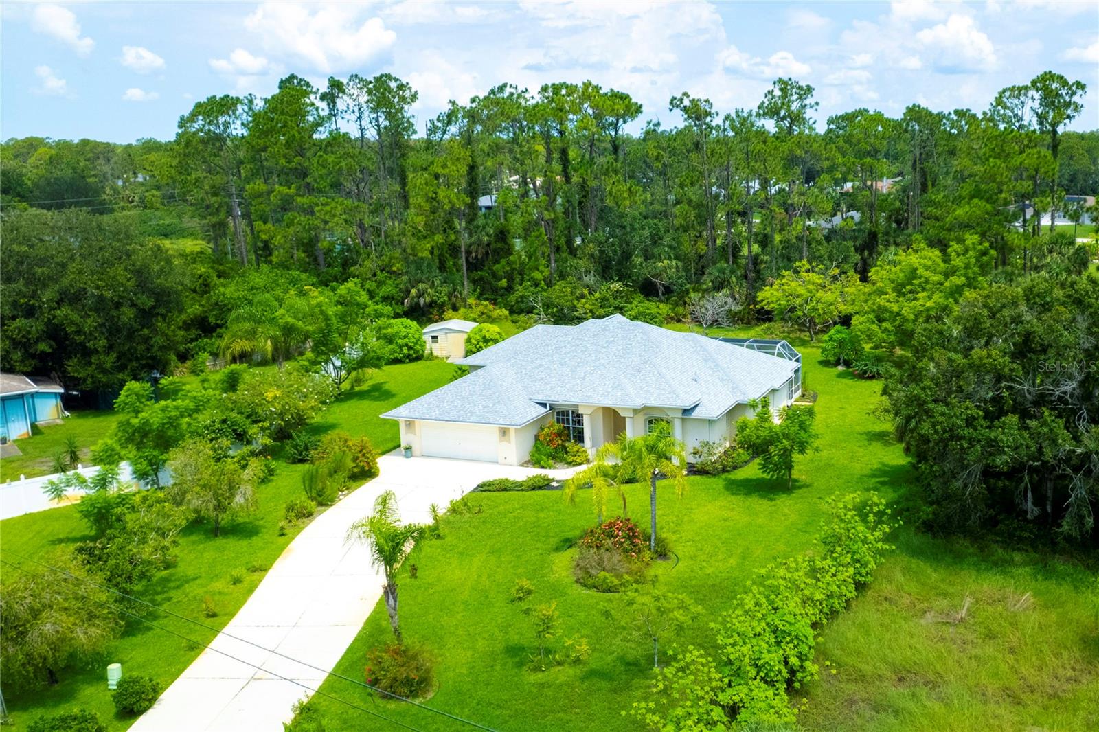 Stunning, custom 2,500 square foot sanctuary that blends elegance, comfort, and serenity in perfect harmony. Nestled on a tranquil canal and set back from the road on a generous half-acre corner lot, this 4-bedroom, 3-bath home is a rare find that offers both space and style. Soaring high ceilings create a sense of airiness and grandeur throughout the home. Huge soaking tub in the master bath suite! Whether you're gathering with guests or enjoying a quiet evening at home, every corner of this house is thoughtfully crafted. FRESHLY painted, NEWER ROOF. BUILT TO LAST. Outside, the half-acre lot features a huge, screened lanai, and a FREE nearly-new hot tub. There is ample space for outdoor living, gardening, or even a future pool—while the canal adds a touch of waterfront magic for kayaking, right in your backyard. This home isn't just a place to live—it's a lifestyle. FREE HOME WARRANTY! NO CDD, NO HOA, NO annoying neighborhood rules. Come see what makes this home so special.