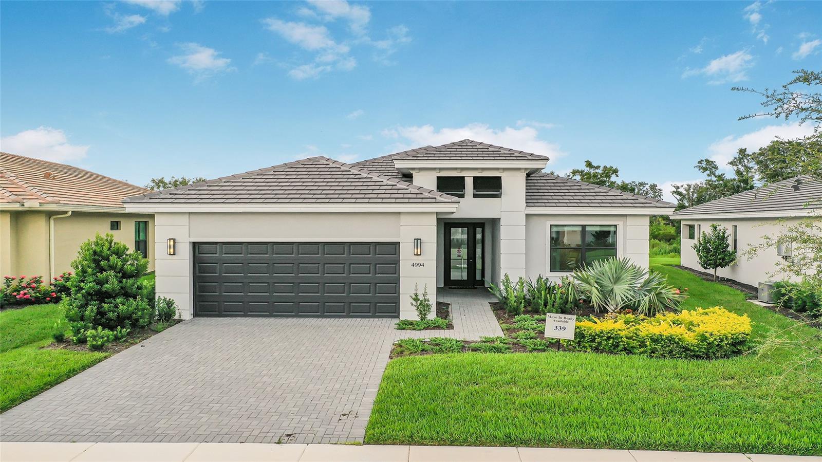 ***New Construction**This stunning Fiesta home is a masterful blend of elegance and functionality. With 3 spacious bedrooms, 3 full bathrooms, and a flexible Den, it offers ample room for comfortable living and effortless entertaining. The open-concept great room flows into a gourmet kitchen outfitted with veined quartz countertops, stainless steel GE appliances, a gas cooktop, and refined cabinetry. Rich laminate wood plank flooring runs throughout, lending warmth and a contemporary edge to the interior. Tray ceilings add architectural depth and sophistication to the main living spaces, enhancing the sense of volume and openness. Step outside to a covered lanai with tranquil preserve views, already equipped with electrical and gas connections for a future pool and summer kitchen. This home is thoughtfully designed to balance everyday comfort with elevated style, and it holds exceptional potential for personalized outdoor living.