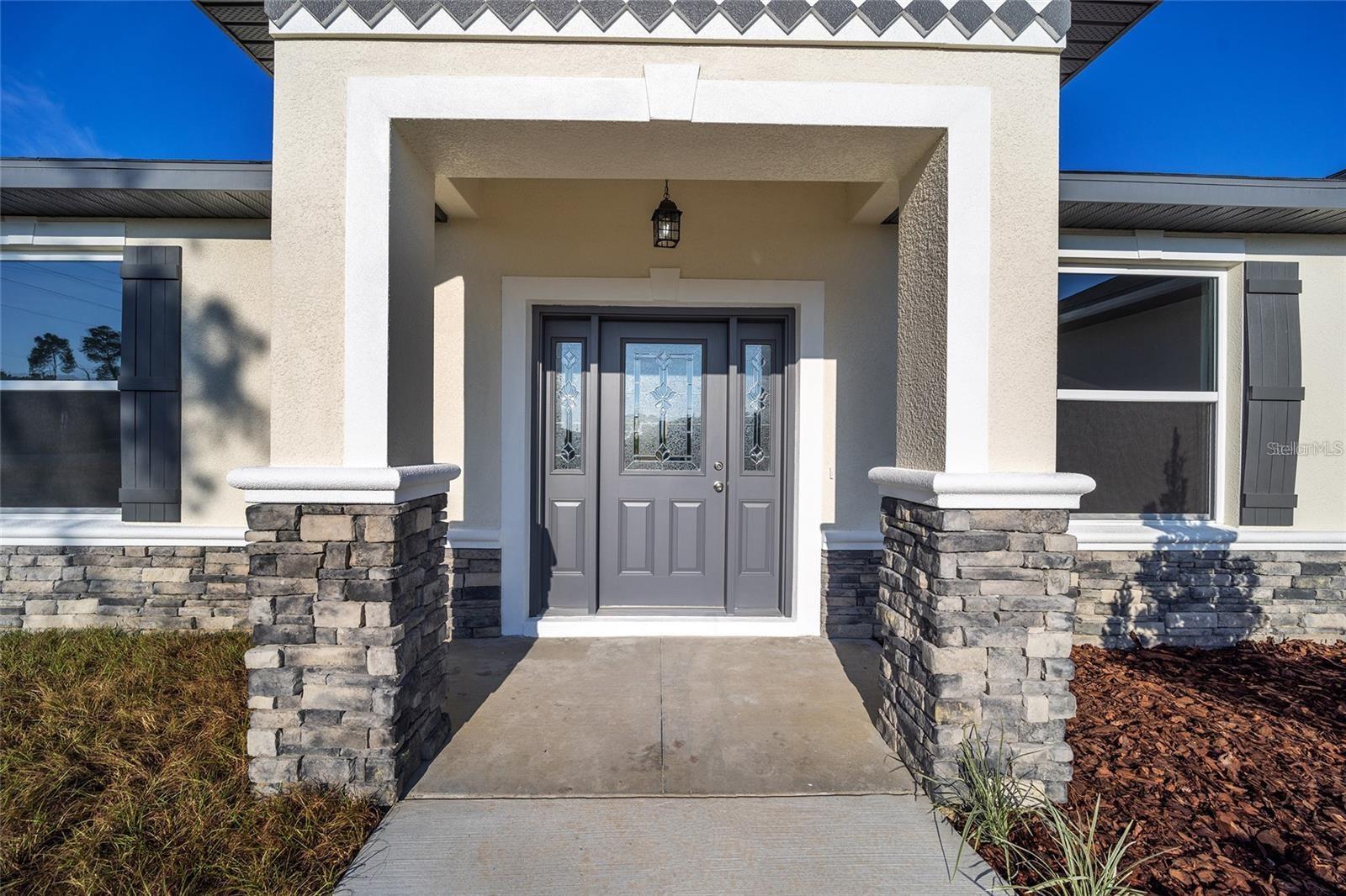 Under Construction. Discover the epitome of modern living in the sought-after Rolling Hills subdivision! This new 3-bedroom, 2-bathroom home boasts an open layout, 2-car garage, and 1818 sq. ft. of living space on over half an acre. Revel in the beauty of the kitchen with elegant cabinets, granite countertops, and stainless-steel appliances. Enjoy waterproof laminate flooring throughout. The master bedroom offers a walk-in closet, while the split floor plan is perfect for families. With a 9.5' high elevation and big windows, the home is flooded with natural light. Outdoor entertainment awaits on the spacious lanai. Conveniently close to schools, shopping, and dining. This upgraded property is a must-see and ready to move in!