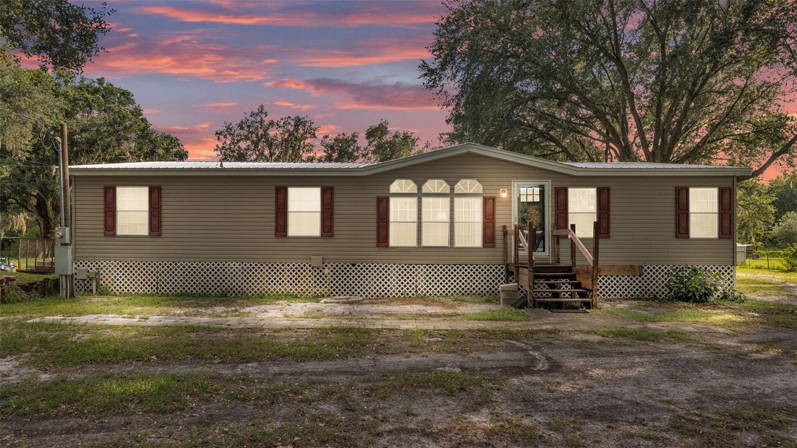 Discover this charming 3-bedroom, 2-bathroom manufactured home situated on a spacious 1.83-acre lot in North Lakeland. Offering 1,860 sqft of comfortable living space, this property provides plenty of room for your family and outdoor activities. Perfect for those seeking a peaceful, private setting with convenient access to local amenities. Don't miss the opportunity to make this your new home!