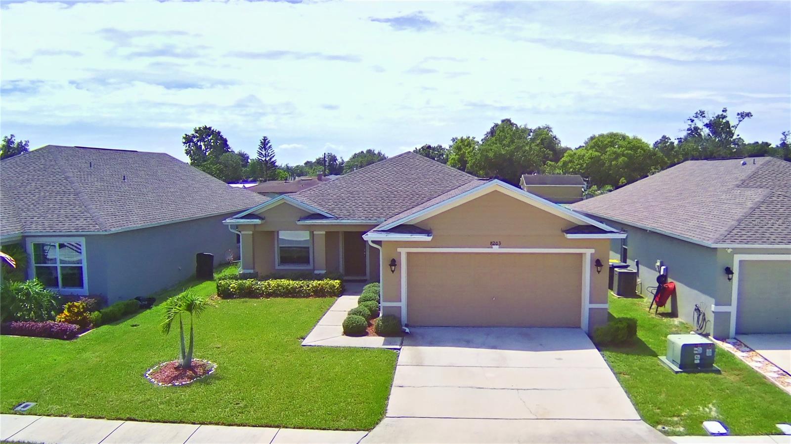 LET ME PRESENT YOU THIS PRISTINE 3 BEDROOMS 2 BATHROOMS, 2 CAR GARAGE HOME. located within a desirable gated community for your privacy and security. The welcoming front porch appeal enhances the home's charm. This turn-key, thoughtfully maintained and professionally staged, features a spacious and practical design. As soon your open the front door you can enjoy the luxury porcelain tile flooring, and carpet in all bedrooms. The modern and big kitchen is equipped with stainless steel appliances, solid wood cabinets, and breakfast knob, making meal preparation and entertaining a joy. An open-concept living and dining area provides the perfect space for creating lasting memories with loved ones. The privacy primary suite offers a luxurious retreat, with two separated sinks, a walk-in shower, a relaxing garden tub, and a spacious walk-in closet in both sides. Two additional well-sized bedrooms offers flexibility to suit your needs Step outside to your fenced backyard and enjoy the delicious fruit trees like papaya, guava, mango, avocado tomatoes and more. Situated for ultimate convenience, this home is just minutes away from shopping, dining, and major roadways, simplifying daily routine.