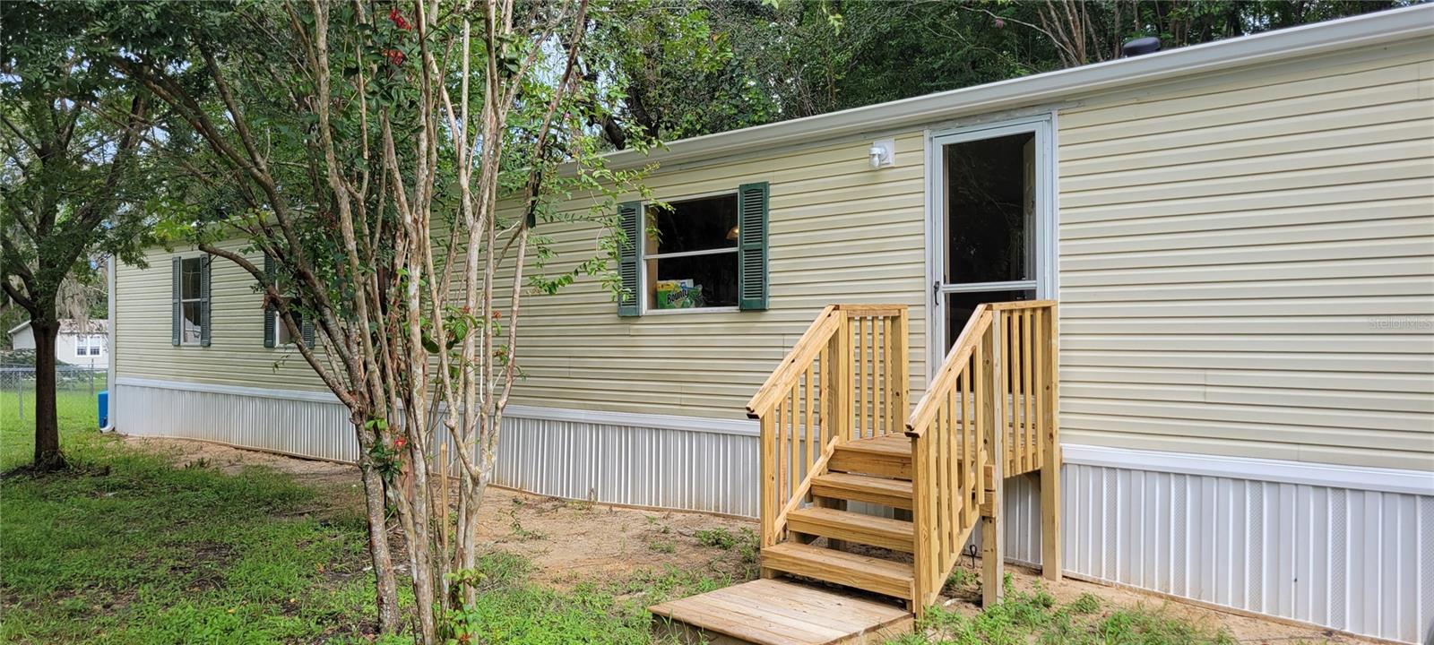 This beautifully updated 2-bedroom, 2-bath manufactured home on 0.24 acres in Little Lake Weir subdivision essential upgrades include a recent roof 3 years ago, New A/C, water heater, laminate flooring (NO CARPET), well has new control box and pressure switch, all new plumbing with CPVC, power pole, and steps. No wasted space in this home bedrooms are at each end so no hallways. Schools are Harbour View Elementary, Lake Weir Middle, and Lake Weir High School, it provides a comfortable and convenient living space perfect for families seeking a move-in-ready Home in a desirable area. Vacant and easy to show.