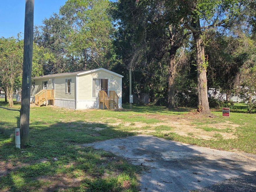 PRICE REDUCED FOR QUICK SALE This beautifully updated 2-bedroom, 2-bath manufactured home on 0.24 acres in Little Lake Weir subdivision essential upgrades include a recent roof 3 years ago, New A/C, water heater, laminate flooring (NO CARPET), well has new control box and pressure switch, all new plumbing with CPVC, power pole, and steps. No wasted space in this home bedrooms are at each end so no hallways. Schools are Harbour View Elementary, Lake Weir Middle, and Lake Weir High School, it provides a comfortable and convenient living space perfect for families seeking a move-in-ready Home in a desirable area. Vacant and easy to show.