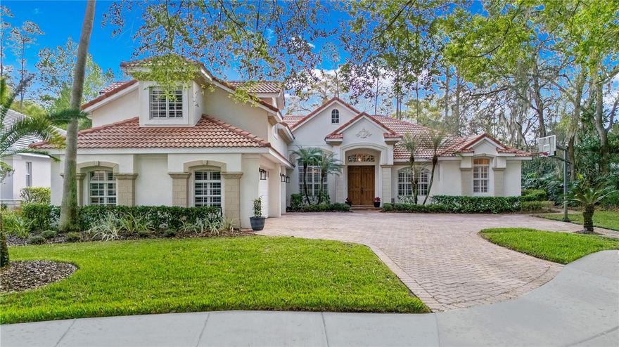 Welcome to 3345 Park Grove Court, an extraordinary estate nestled within the guard-gated golf community of Alaqua Lakes. Perfectly positioned on a private, wooded homesite with no rear and only one side neighbor, this residence offers a rare sense of serenity paired with refined luxury and an active Florida lifestyle.

Meticulously maintained by its owners, this stunning 5-bedroom, 4-bathroom home showcases exceptional craftsmanship, soaring ceilings, and elegant architectural details throughout. Rich finishes, plantation shutters, and expansive windows create a light-filled interior that feels both refined and inviting.

Designed with both privacy and functionality in mind, the split floor plan offers generous living spaces ideal for everyday comfort and effortless entertaining. At the heart of the home, the kitchen features a center island, abundant cabinetry, and seamless flow into the main living and gathering areas—perfect for hosting everything from intimate dinners to large celebrations. 

The primary suite is a private retreat, beautifully situated to overlook the pool and lush landscape. The primary bathroom has been tastefully updated and features dual vanities, a soaking tub, and a separate walk-in shower, along with a spacious, thoughtfully divided closet.

Three additional bedrooms are conveniently located on the first floor, while the second level offers a versatile fifth bedroom or bonus suite complete with a full bath with shower—ideal for guests, a media room, or multigenerational living.

Step outside to experience true Florida luxury living. The expansive screened lanai is designed for year-round enjoyment and features a large saltwater pool and spa, paver decking, a sunning area, and generous covered seating spaces—perfect for relaxing or entertaining against a peaceful, wooded backdrop.

A dedicated office with a closet adds flexibility and can easily function as a sixth bedroom, playroom, or private study.

Located just steps from the community’s exceptional amenities, residents of Alaqua Lakes enjoy access to a pavilion, 7-acre park, junior Olympic pool, Har-Tru tennis courts, beach volleyball, basketball courts, multipurpose fields, playground, and social events all within a natural gas community known for its exclusivity and lifestyle.

Located in highly sought-after Seminole County, this home benefits from a top-rated school system, an abundance of scenic walking and biking trails, and easy access to some of Central Florida’s most beautiful natural springs, offering a lifestyle rich in both education and outdoor recreation.  3345 Park Grove Court offers convenient access to major highways providing an easy commute to downtown Orlando and surrounding business hubs. World-class destinations such as Walt Disney World, Universal Orlando Resort and SeaWorld Orlando are just 30–45 minutes away, while the beautiful Atlantic beaches, including New Smyrna Beach and Daytona Beach are approximately an hour drive.