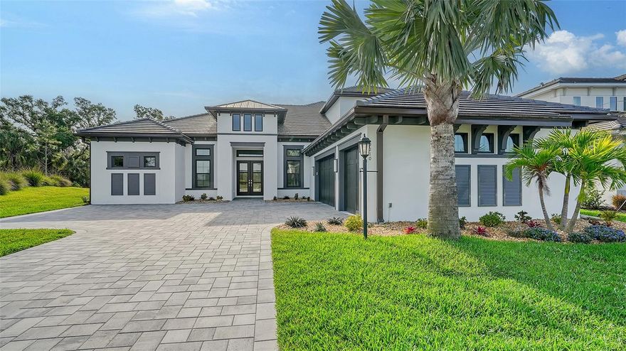 Welcome to an oasis of luxury living in the esteemed gated community of Cassia, nestled within Skye Ranch in beautiful Sarasota, FL. This stunning residence offers immediate occupancy, presenting an unparalleled blend of sophistication, comfort, and convenience. Boasting a prime location, residents of Cassia enjoy easy access to the world-renowned Siesta Key Beach and the vibrant downtown Sarasota, where an array of dining, shopping, and cultural experiences await. Upon entering this magnificent home, you are greeted by an incredible custom kitchen that is sure to impress even the most discerning chef. Featuring exquisite custom cabinets, a double-height island adorned with a waterfall quartz countertop, and state-of-the-art appliances, this kitchen is as functional as it is visually stunning, making it the heart of the home. Designed with safety and security in mind, the property is equipped with impact-rated windows, providing maximum protection during wind events while maintaining a sense of peace and tranquility indoors. Upstairs, discover a versatile loft area complete with a full bedroom, bathroom, and mini kitchen, offering the perfect retreat for guests. Step outside to experience the ultimate in outdoor living, where a sparkling pool with a sun shelf beckons for refreshing dips on warm Florida days. Entertain with ease at the outdoor kitchen, while soaking in the serene views of the adjacent nature preserve, creating a picturesque backdrop for gatherings and relaxation. For the automotive enthusiast, the oversized garage is a dream come true, featuring custom cabinets and dual Tesla charging stations already installed, providing both functionality and convenience. Residents of Skye Ranch enjoy an array of exclusive amenities, including walking trails, community parks, and recreational facilities, with the added bonus of a new K-12 school being built within the community, offering educational opportunities just steps from home. Don't miss the chance to elevate your lifestyle to new heights at this luxurious retreat in Cassia, where every detail has been meticulously crafted to exceed expectations. Schedule your private tour today and prepare to embark on a journey of unparalleled luxury and comfort!