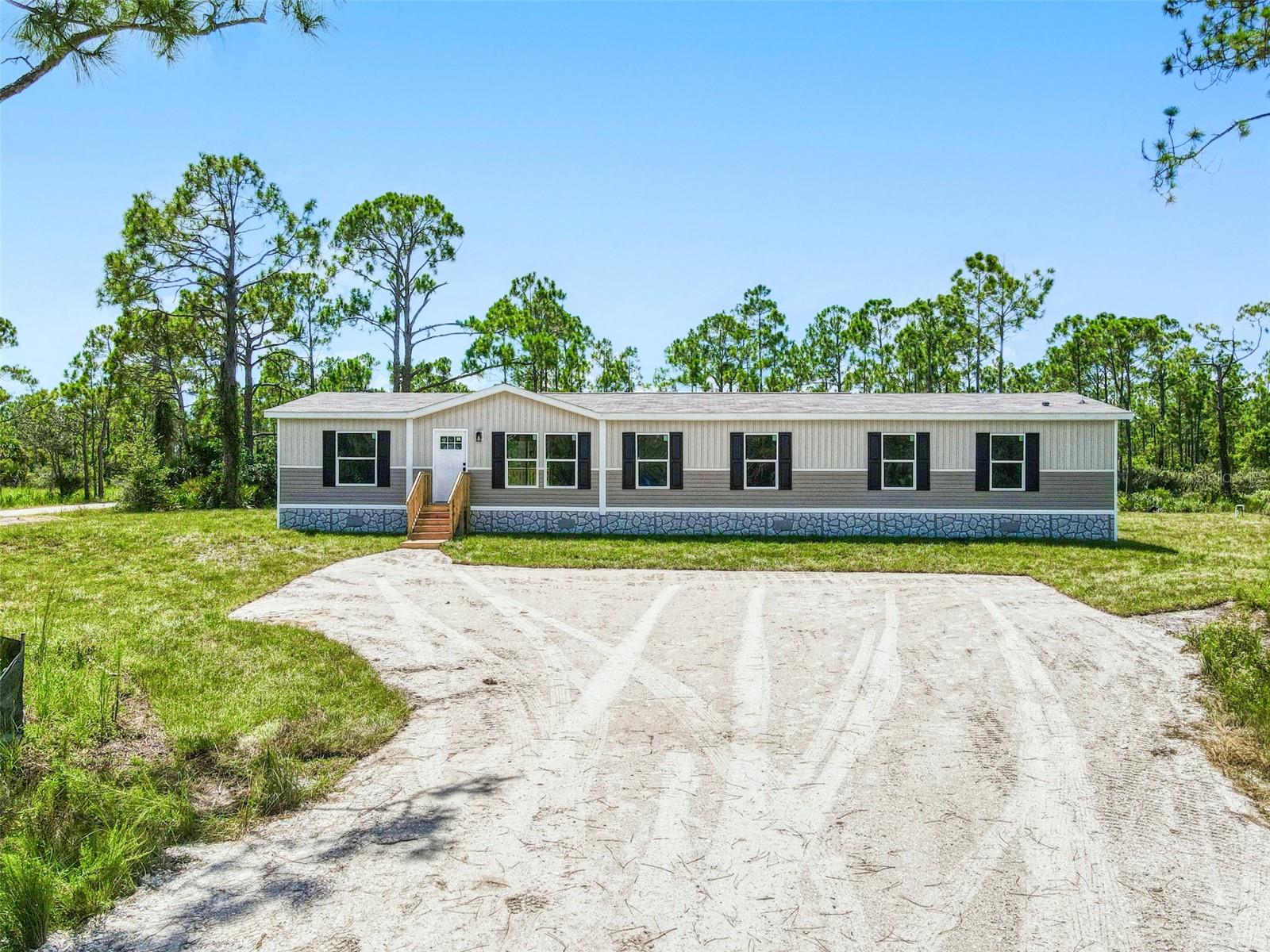 Welcome to country living in the Charlotte County Ranchettes. This 1.25-acre property offers the freedom and space so many are searching for in Southwest Florida. Surrounded by wide-open skies and quiet gravel roads, this manufactured home floor plan provides five bedrooms and three bathrooms, giving plenty of room for family, guests, or a home office. The open layout creates an easy flow between the living spaces, with a spacious kitchen and dining area designed for gatherings and everyday living.
Step outside and experience the lifestyle that makes the Ranchettes so unique. With agricultural zoning, you can enjoy the opportunity to raise livestock, keep horses, or even start your own small farm. ATV rides, horseback trails, and wide-open spaces are part of daily life here, making this an ideal setting for anyone who wants both freedom and community.
Whether you are looking for a family homestead, a seasonal retreat, or simply a quiet place to spread out, this home offers the perfect balance of rural charm and modern comfort. Discover the best of Florida country living right here in the Charlotte County Ranchettes.