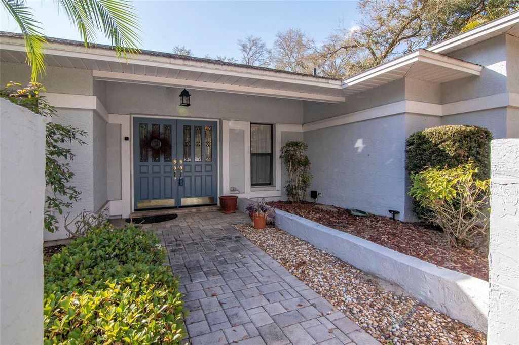 Photo of 8440 Cranes Roost Dr, New Port Richey, FL 34654 (MLS # TB8481853)