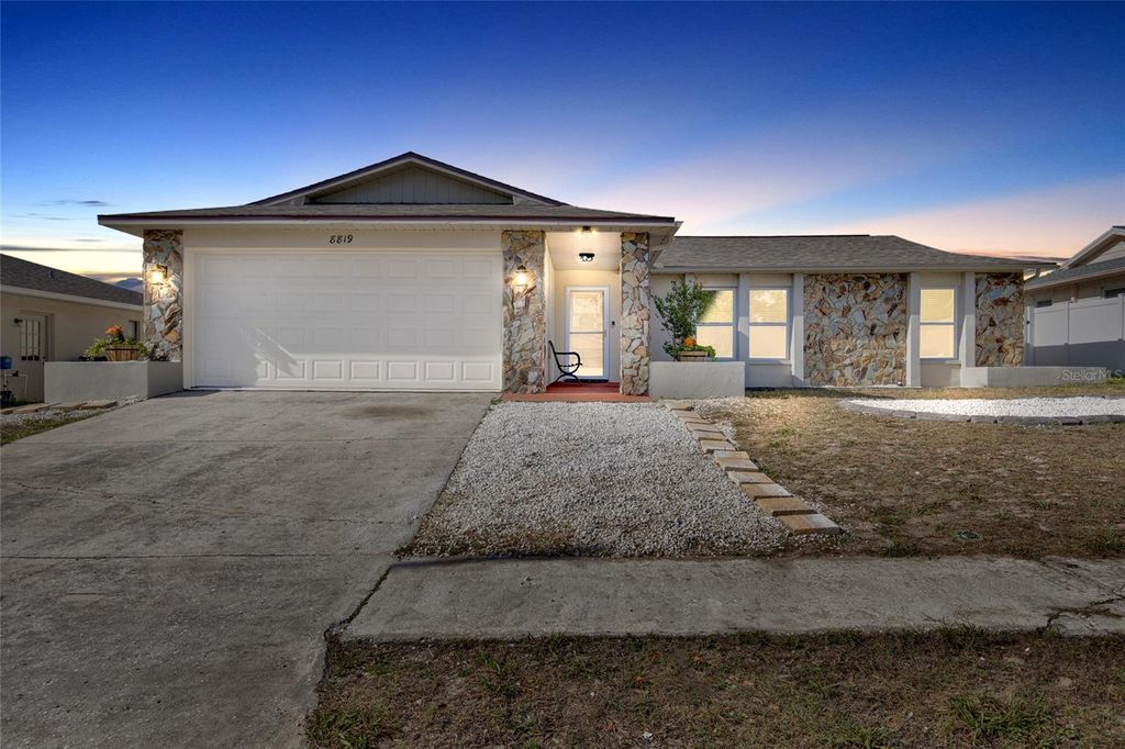 Photo of 8819 Woodmont Lane, Port Richey, FL 34668 (MLS # TB8494314)