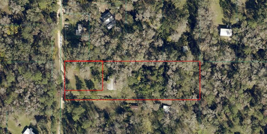 This 2.53ac property, made up of two parcels, offers endless potential just minutes from town! The lot is mostly cleared with beautiful mature trees providing shade and character. A home currently sits on the property but will need to be torn down. Well, septic, and electric are already in place, giving you a head start on your build. A great opportunity to create your own space with utilities and natural charm already on site.