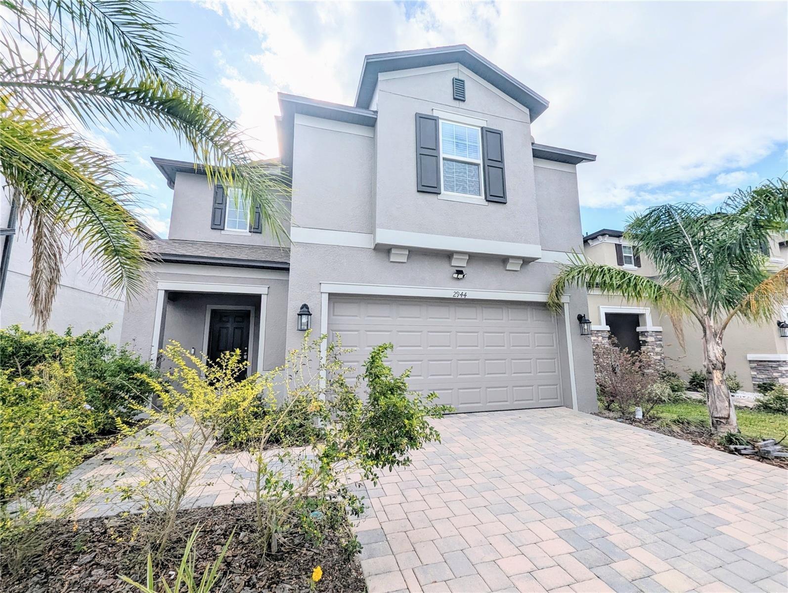 This stunning 4-bedroom, 3-bath home, built in 2022, offers breathtaking water views and is now available! Located in a small, vibrant community, residents enjoy resort-style amenities, including an Olympic-sized pool, playground, picnic area, and clubhouse. The open floor plan creates a bright and inviting living space, with the great room, kitchen, and dining area all overlooking the water. The kitchen is a chef’s dream, featuring a large stone-topped island, solid wood cabinets, granite countertops, stainless steel appliances, and a walk-in pantry for extra storage. On the main level, you'll also find a versatile fourth bedroom—perfect for a home office or guest room—along with a full bath. Upstairs, the spacious primary suite offers a walk-in closet and a luxurious ensuite with dual sinks and a separate shower. Two additional bedrooms, another full bath, and an open loft/flex space provide plenty of room to spread out. The dedicated laundry room adds even more storage, and the washer and dryer remain for your convenience. Additional highlights include a two-car garage, ample storage throughout, and high-end finishes. The security deposit of $2,550, along with the first month’s rent (prorated based on the move-in date), is due upon move-in. Applicants must have no prior evictions or felonies, a minimum credit score of 550, and verifiable income—no exceptions. Tenants are responsible for utilities and lawn maintenance. Don’t miss this incredible opportunity to live in a beautiful waterfront home with access to top-tier community features!