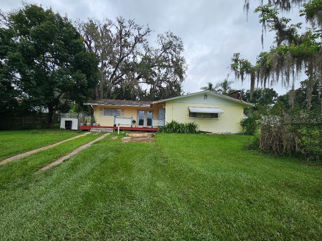 3 bedroom 2 bath block home situated on a large .27 of an acre lot. Fireplace with built in bookshelves in the living room. Nice Secondary bedrooms that are generously sized. Gorgeous, fenced back yard that is perfect for afternoon cook outs, the boat ramp and public doc to Lake Pasadena is located approximately 3 blocks over. You have a water view across the street from the house of the inlet that leads out to Lake Pasadena. This home needs TLC so bring your toolbox and creative dreams and turn this house into your home.
