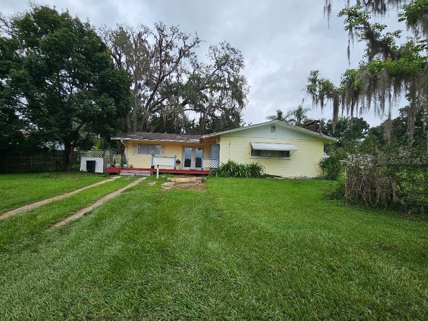 3 bedroom 2 bath block home situated on a large .27 of an acre lot.  Fireplace with built in bookshelves in the living room.  Nice Secondary bedrooms that are generously sized. Gorgeous, fenced back yard that is perfect for afternoon cook outs, the boat ramp and public doc to Lake Pasadena is located approximately 3 blocks over.  You have a water view across the street from the house of the inlet that leads out to Lake Pasadena.  This home needs TLC so bring your toolbox and creative dreams and turn this house into your home.