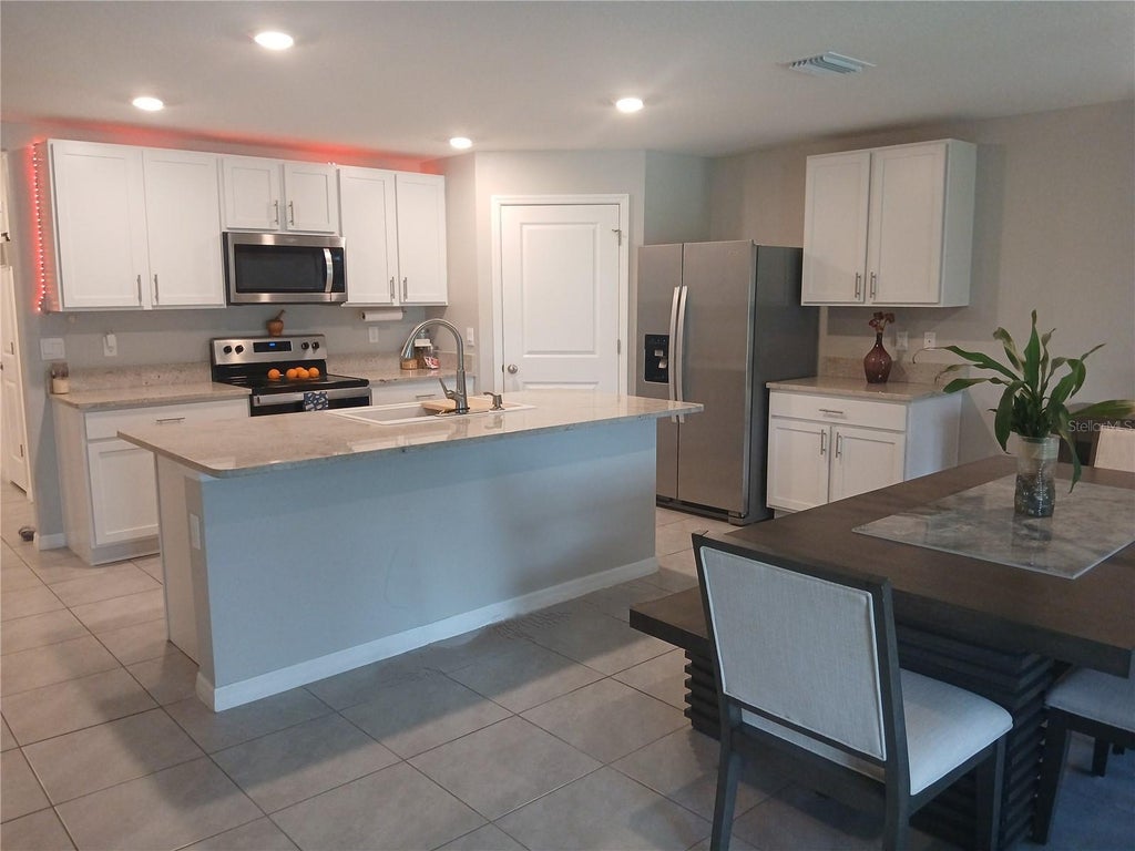 Photo of 3719 Capri Coast Drive, Plant City, FL 33565 (MLS # TB8515540)