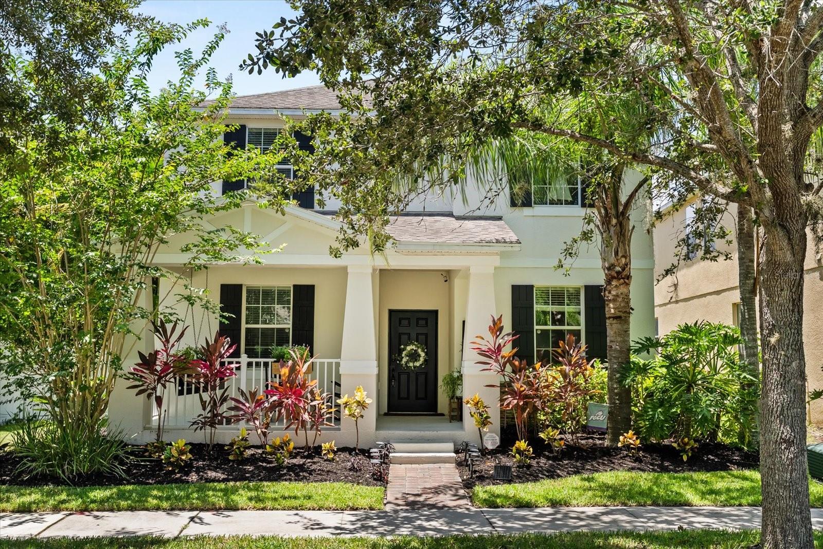 You’ll love everything about this beautifully appointed 5BR pool home in the desirable Signature Lakes community – move in ready with room for everyone and everything! It starts with great curb appeal – nicely landscaped corner lot with quaint front porch. Step inside to a flex room – versatile to arrange to suit your needs. Walk back to the WOW factor – expansive great room with your kitchen, living and dining space, making a great gathering space. Gourmet style kitchen boasts granite counters, island with breakfast bar, attractive tile backsplash, closet pantry and pendant & recessed lighting. One bedroom is on the ground floor – ideal for a guest. Primary suite boasts HUGE bedroom – room for a sitting area - with a tray ceiling which elevates the look. Here you will enjoy a generous sized ensuite bath w/dual sink vanity and tub w/separate shower. Don’t forget to take a look in the walk-in closet – custom drawers/shelving are a plus! Remaining bedrooms are spacious enough for desks – perfect for those working from or studying at home. Notable flooring features: waterproof laminate downstairs, vinyl tile in the upstairs bathrooms and luxury pet proof carpet upstairs. A big reason to want to own this home is all that you have outback – pristine pool w/spa and waterfall surrounded by a paver stone patio. Covered patio space and a separate tiki bar add to the resort ambience. All of this is fenced in and surrounded by tropical landscaping – truly giving you a private oasis where you can enjoy fun in the sun. Great location - Signature Lakes is a neighborhood of well-maintained homes, tree lined streets, and access to fabulous amenities: clubhouse with fitness center, playgrounds, parks, tennis, basketball, and community boats ramp (Lakes Hancock/Speer). High speed internet & cable TV are included in your dues! You're only a mile from the Hamlin retail district, giving you easy access to essential shopping, fun dining spots, a cinema, and SR 429. Excellent school district, too! This home SHINES, both inside and out. Come see all that makes it so special!