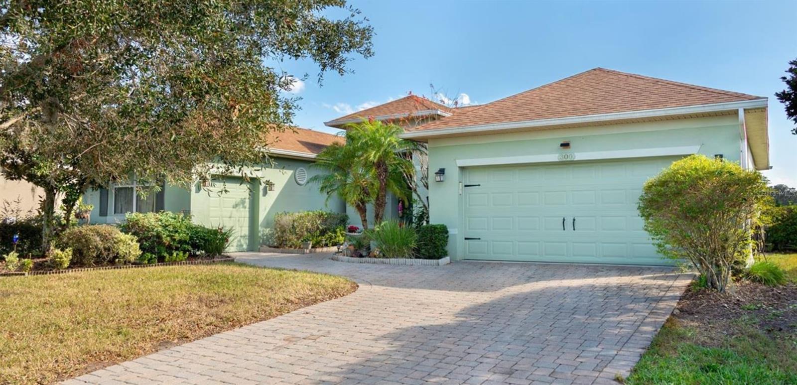 Welcome to this beautiful single-family 3/3 home, a true gem in Solivita's sought-after Bella Viana neighborhood. This isn't just a home; it's a lifestyle upgrade. Step inside and discover a host of recent updates. The kitchen now features sleek granite countertops, and for your peace of mind, the AC and water heater are brand new, eliminating any big-ticket surprises. The home is also equipped with a modern solar system, which means lower electric bills from day one. The unique BACH model is perfectly situated on the PGA Championship Cypress Golf Course, offering a lifestyle of luxury and convenience. A rare find, it features both a two-car garage and a separate golf cart garage, giving you the extra space you've been looking for. Located just a short stroll or cart ride from the community pool and clubhouse, you'll have easy access to all the amenities of this premier 55+ community. Solivita offers 36 holes of golf, miles of walking trails, and a vibrant social scene, all just 35 minutes from Disney and under an hour from major Orlando attractions. This is your chance to live the life you've earned.