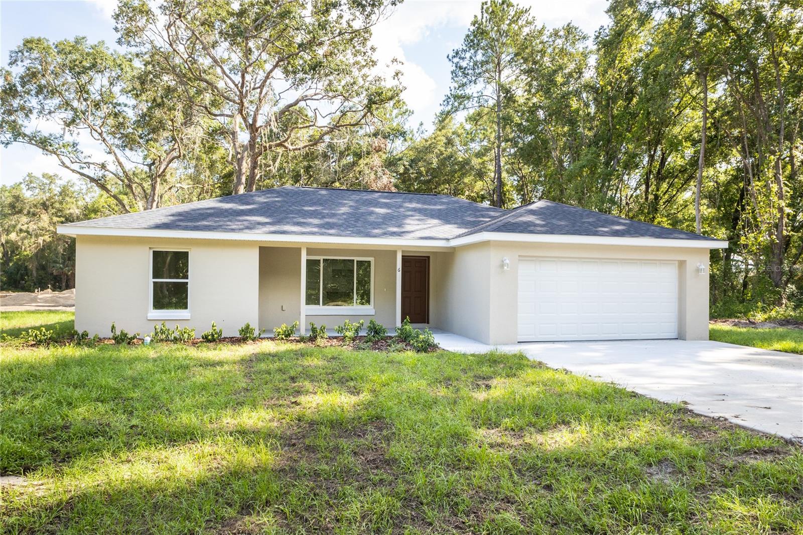Under Construction. Great home in Ocklawaha now available This beautiful Lynette Model by Shamrock Construction has a well designed open floor plan and plenty of windows. This home comes well upgraded with Luxury Vinyl Plank Flooring throughout, Granite in Kitchen and Baths, Upgraded Fixtures, Ceiling Fans, Stainless Steel Appliances, Soft Close Cabinet Doors and Drawers, and a Large Back Patio Slab. The best part is it is SOLID CONCRETE BLOCK CONSTRUCTION. Coming with a 1 Year Full Builders Warranty and 10 Year Structural Warranty. Come see high quality concrete block construction.