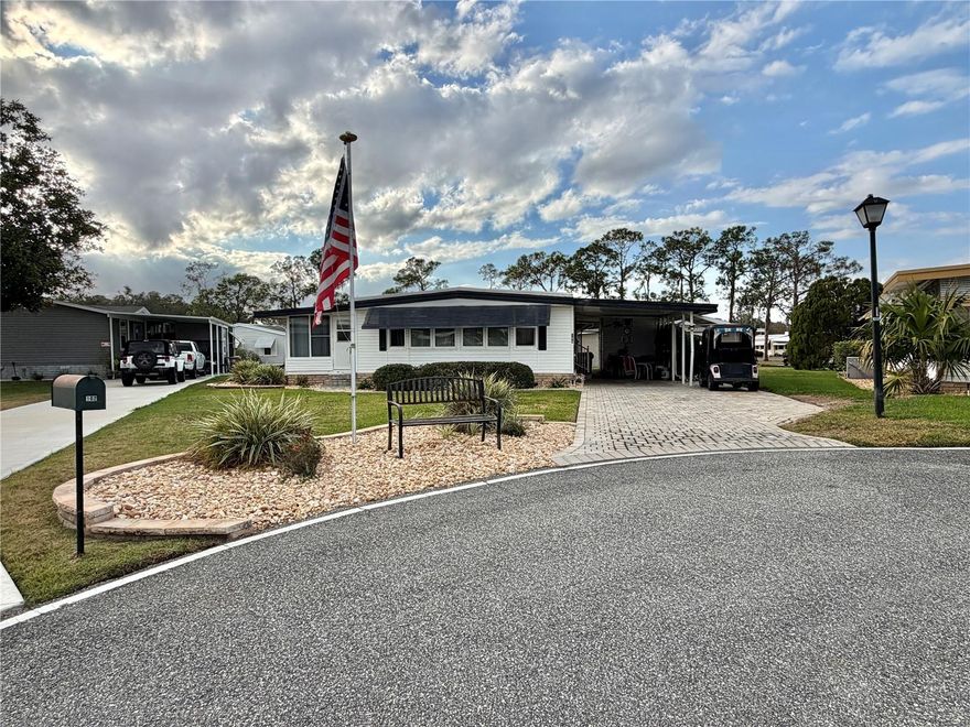 Welcome to 104 Dogwood Trail! This charming 2-bedroom, 2-bath home boasts fantastic curb appeal with a long upgraded paver driveway offering ample parking. Enjoy peace of mind with major updates already completed, including a new roof (2022), a recently updated HVAC system (2025), and newer windows throughout. Inside, the home features laminate flooring and beautiful stone/granite countertops that add style and functionality. Don’t miss your chance to see this home!...Hawthorne at Leesburg is an active, resident owned, 55+ cooperative, waterfront, gated community, with beautifully landscaped grounds, lakes with illuminated fountains and a relaxing and comfortable gazebo. The affordable monthly maintenance fee of $397 includes water, sewer, lawn mowing, private emergency services and storage space for recreational vehicles, boats, trailers and much more! The beautiful clubhouse is complete with a full-time program coordinator, more than 100 different activities and seating for 550. It has a hospitality lounge, card rooms, craft rooms, billiard room, fitness center, library, fine arts room and many more. There is excellent fishing, outdoor geo-thermally heated pool and two enclosed therapeutic pools. Hawthorne boasts a private marina monitored by an electronic security system with over 120 boat slips and access to the Harris Chain of Lakes and beyond.