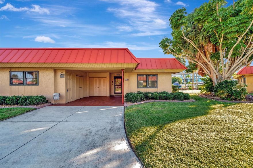 Welcome to Palma Sola Harbour Condominiums, a premier gated waterfront community offering resort-style amenities and easy access to the bay with no fixed bridges! Step outside to your private dock with boat lift, and take your new boat out for a spin—THE 2022 CAROLINA SKIFF  JLS IS INCLUDED IN THE PURCHASE! This bright and spacious 2-bedroom, 2-bathroom corner unit features 1,296 sq. ft. of open living space filled with natural light and tranquil canal views. The kitchen is beautifully appointed with granite countertops, abundant cabinet space, and an open layout perfect for entertaining. Enjoy the convenience of a laundry room with a full-size washer and dryer, plus outside storage for your beach and boating gear. Additional highlights include a walk-in tub featuring hydro-therapy jets allowing for a spa-like experience. Palma Sola Harbour is a pet-friendly community featuring two heated pools, a clubhouse, tennis and pickleball courts, two dry saunas, a fitness center, a workshop with lots of tools, and a billiards room. Enjoy the ultimate Florida lifestyle—waterfront living, boating, and resort-style amenities—all in one exceptional property.